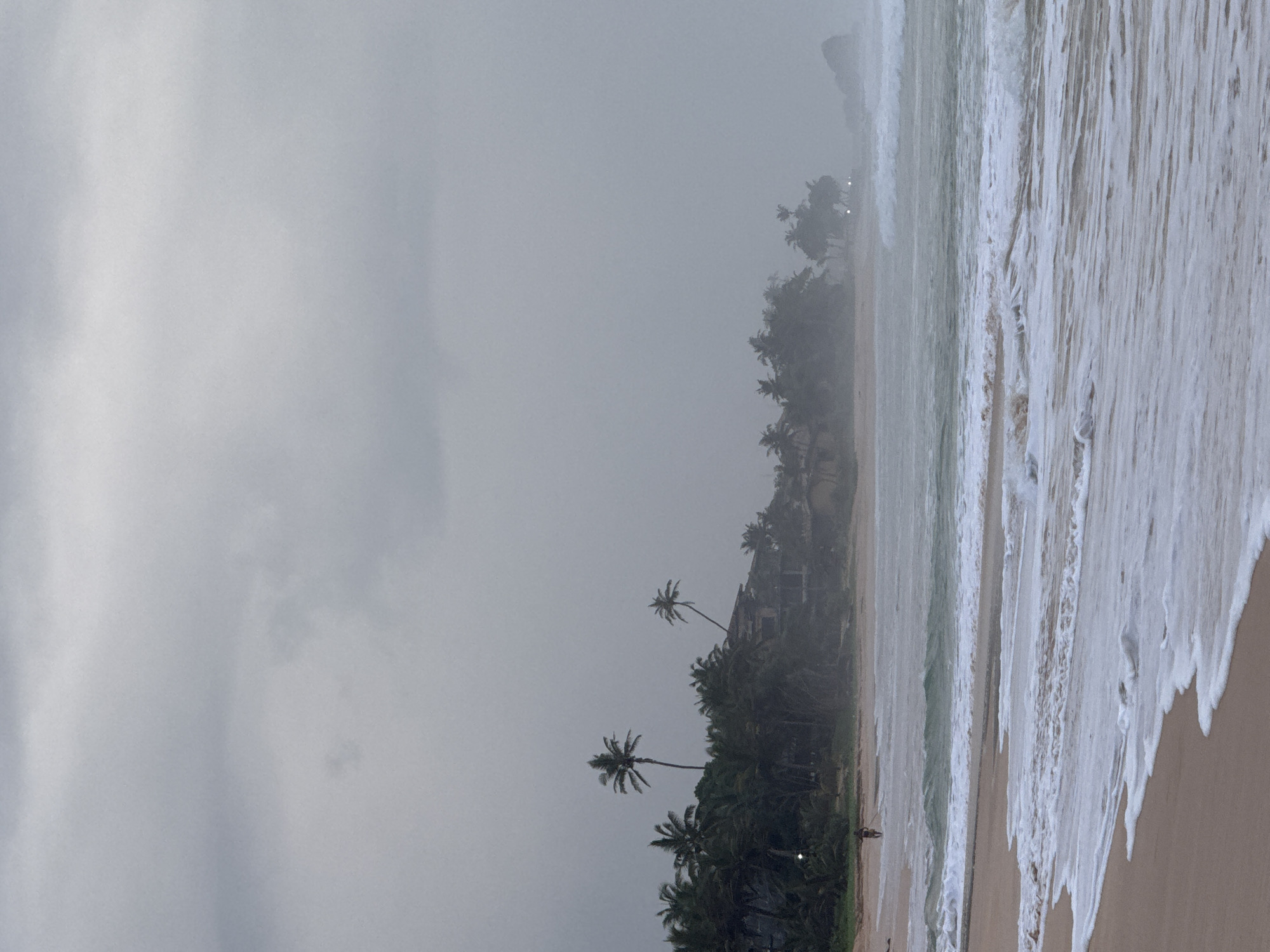 Koggala beach on a moody afternoon, moon out in daylight