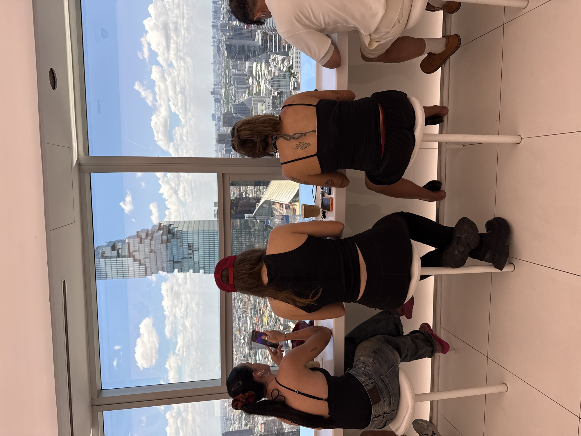 Early morning coffee shop visitors enjoy Bangkok skyline views