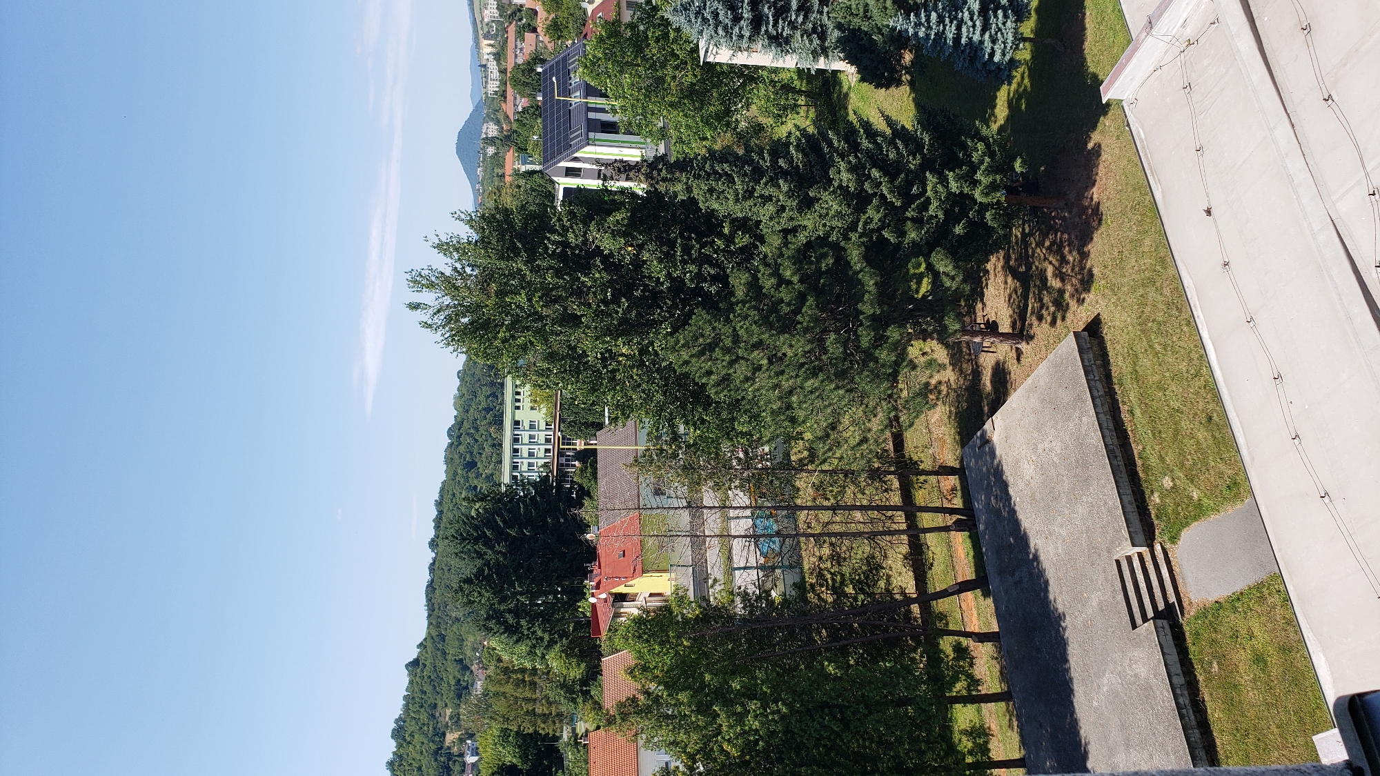 Suburban Prešov on a summer afternoon, with motivational text mixed in.