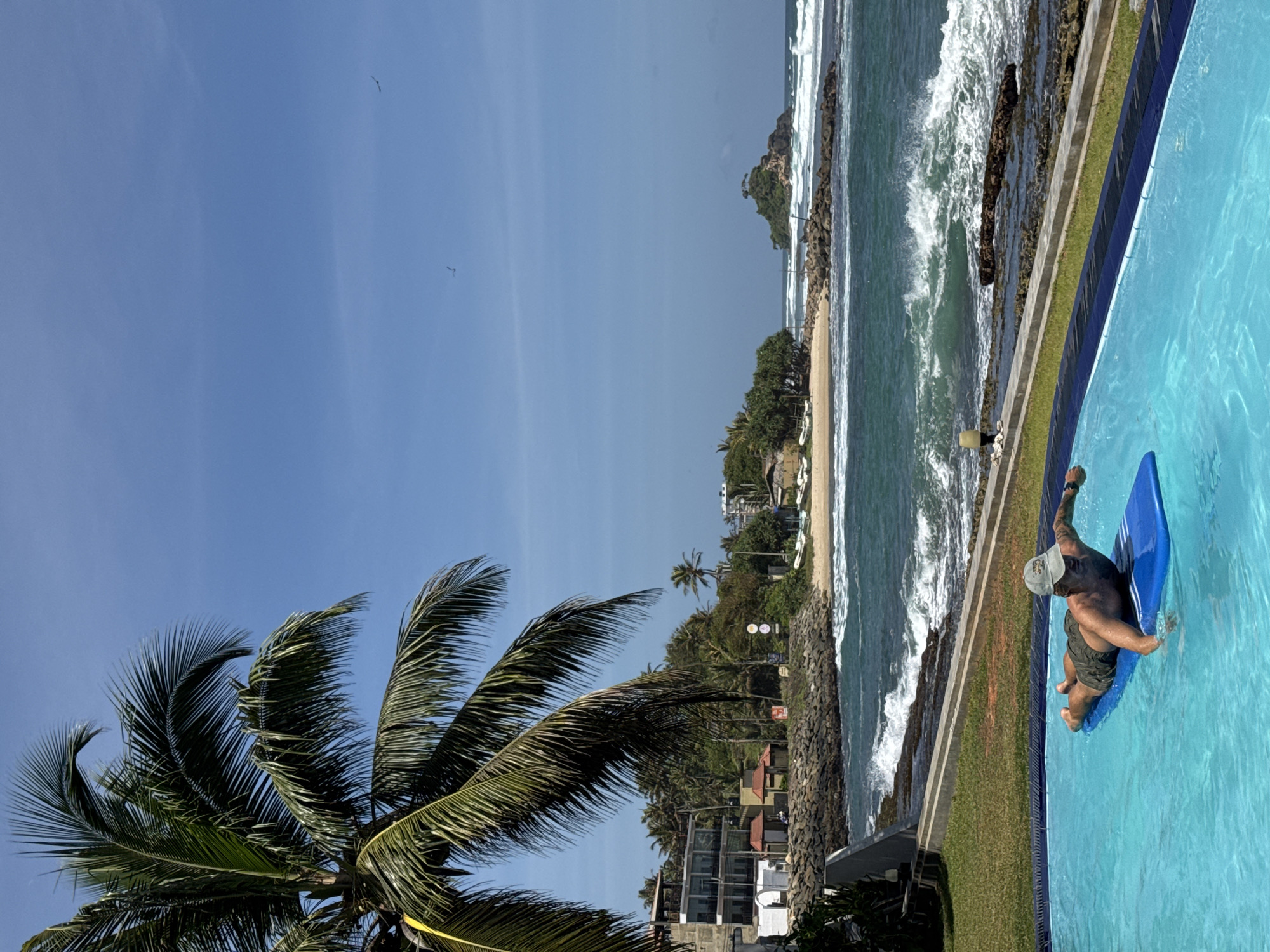 Lazy pool morning at a Sri Lanka resort with ocean views