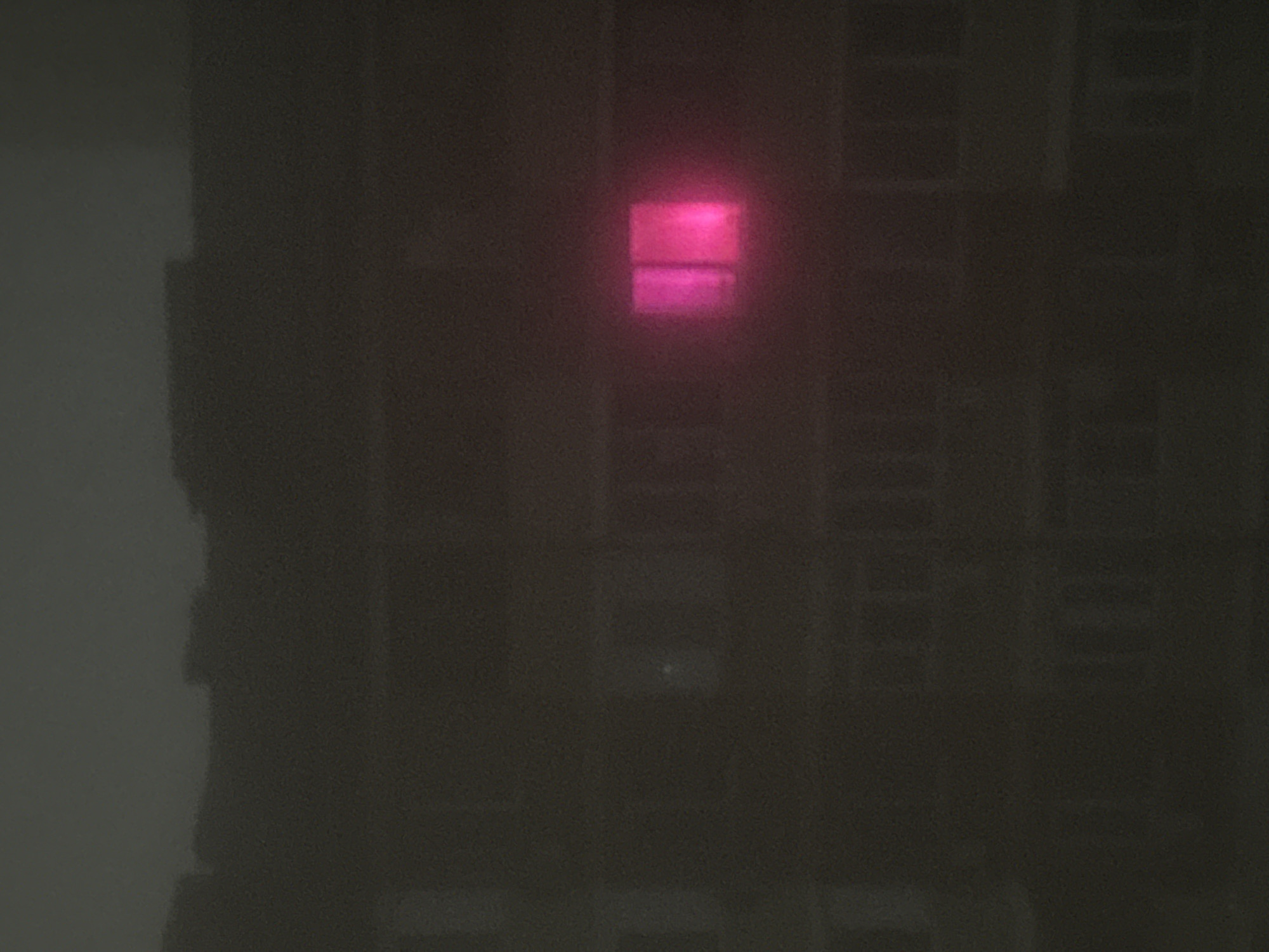 Heavy fog blankets city streets during late evening hours
