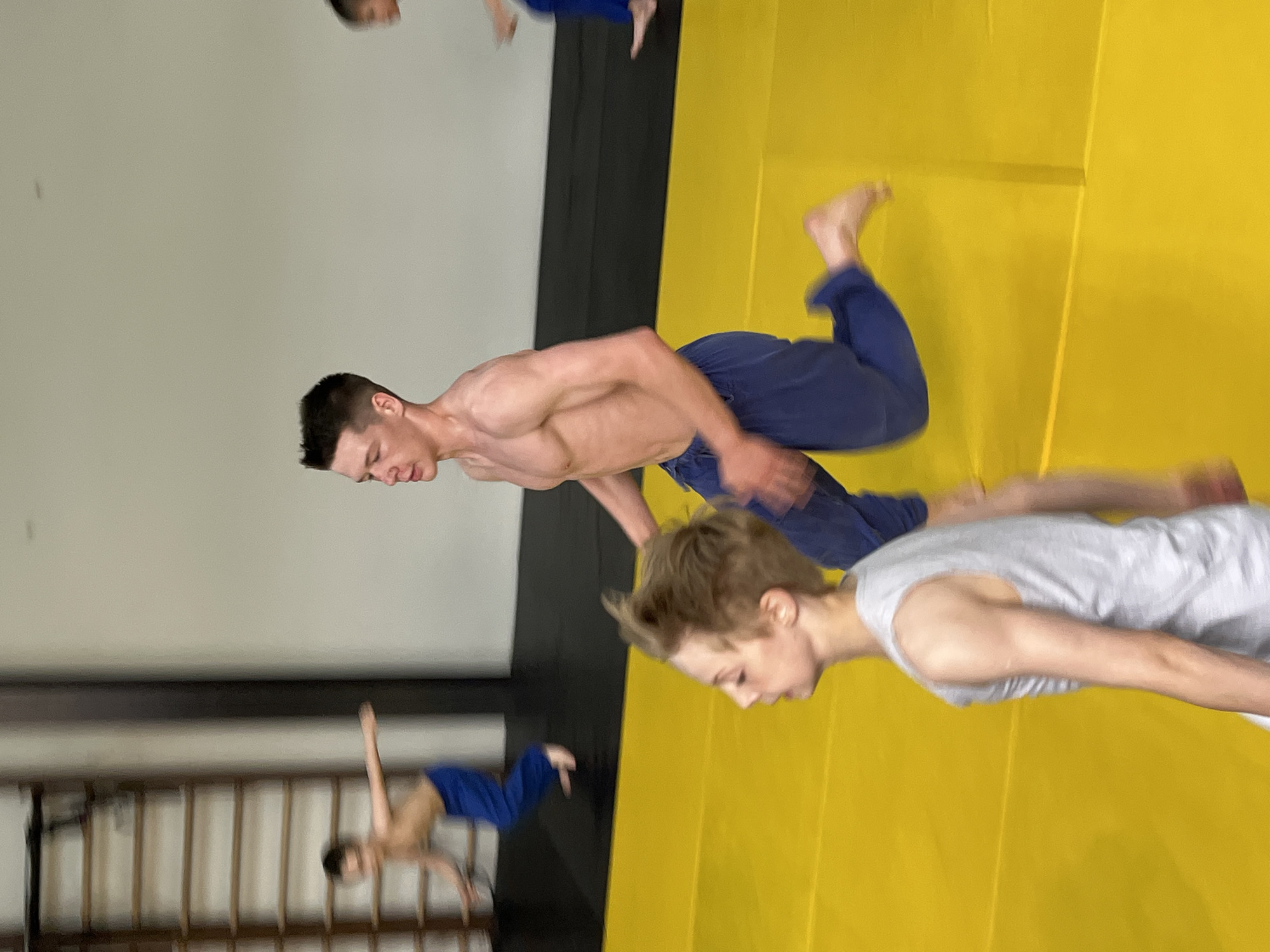 Youth martial arts training session documented in Krasnoyarsk gymnasium