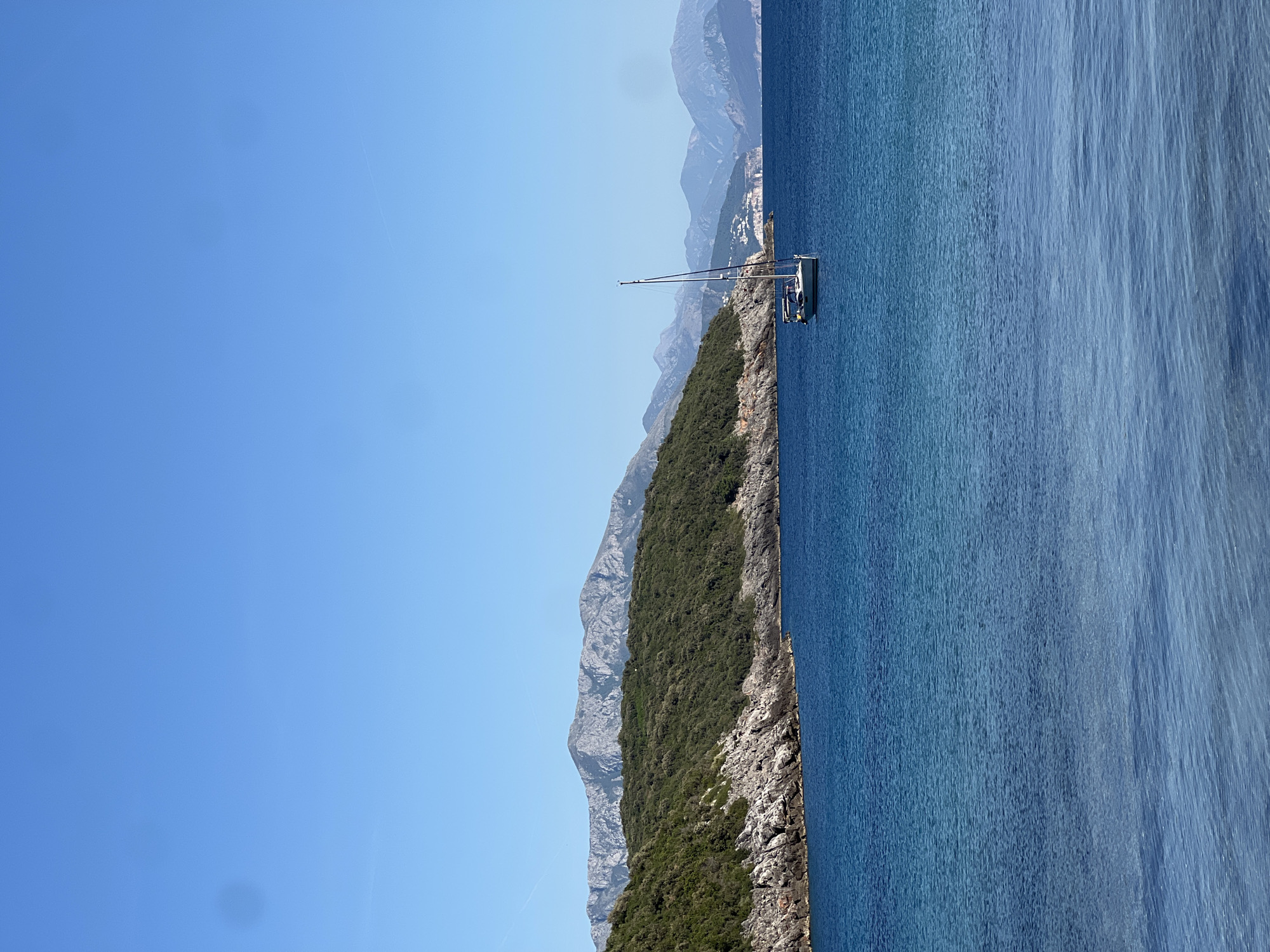 Person enjoys scenic moment on Montenegro's Adriatic coastline