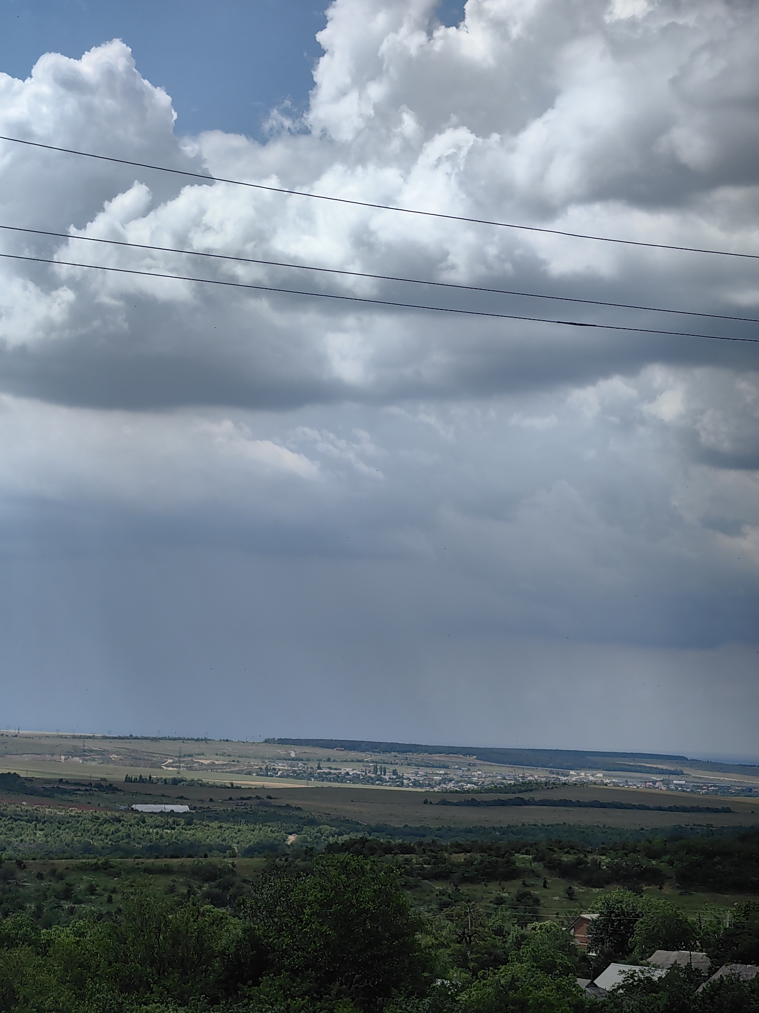 Storm clouds gather as strawberries harvested in rural area