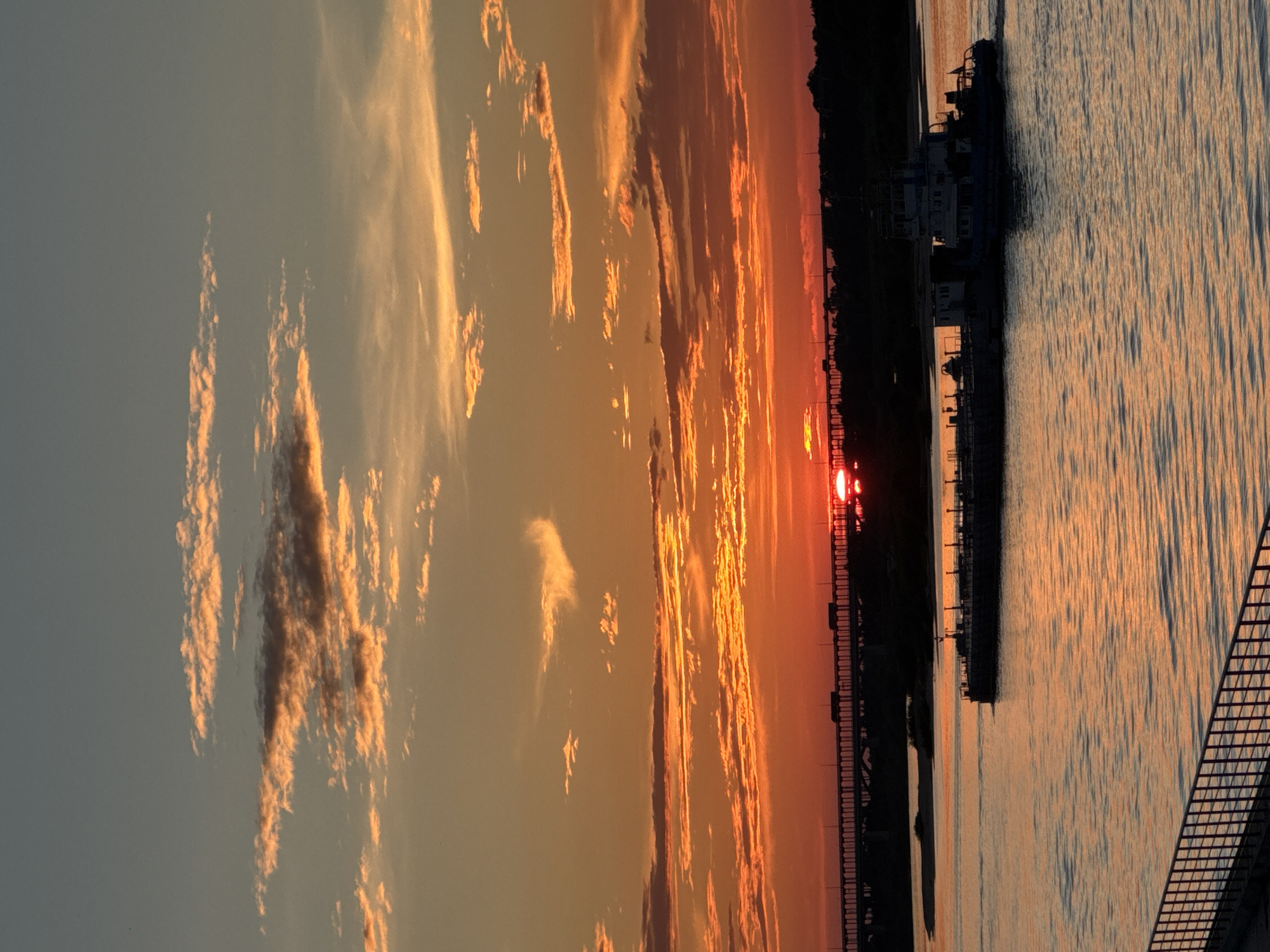 Volga River sunset with barges and bridges, Nizhny Novgorod