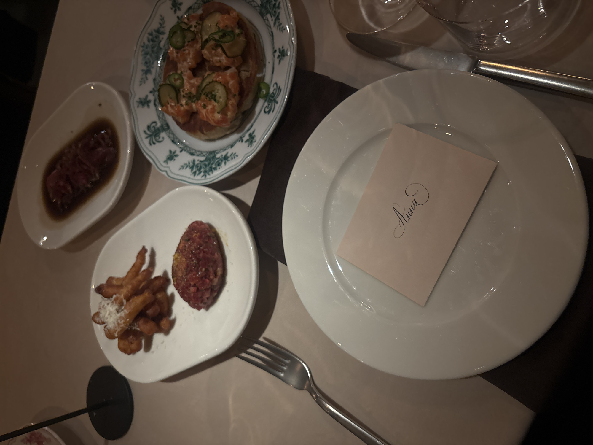 Dining table with marinated beef dishes photographed in Moscow