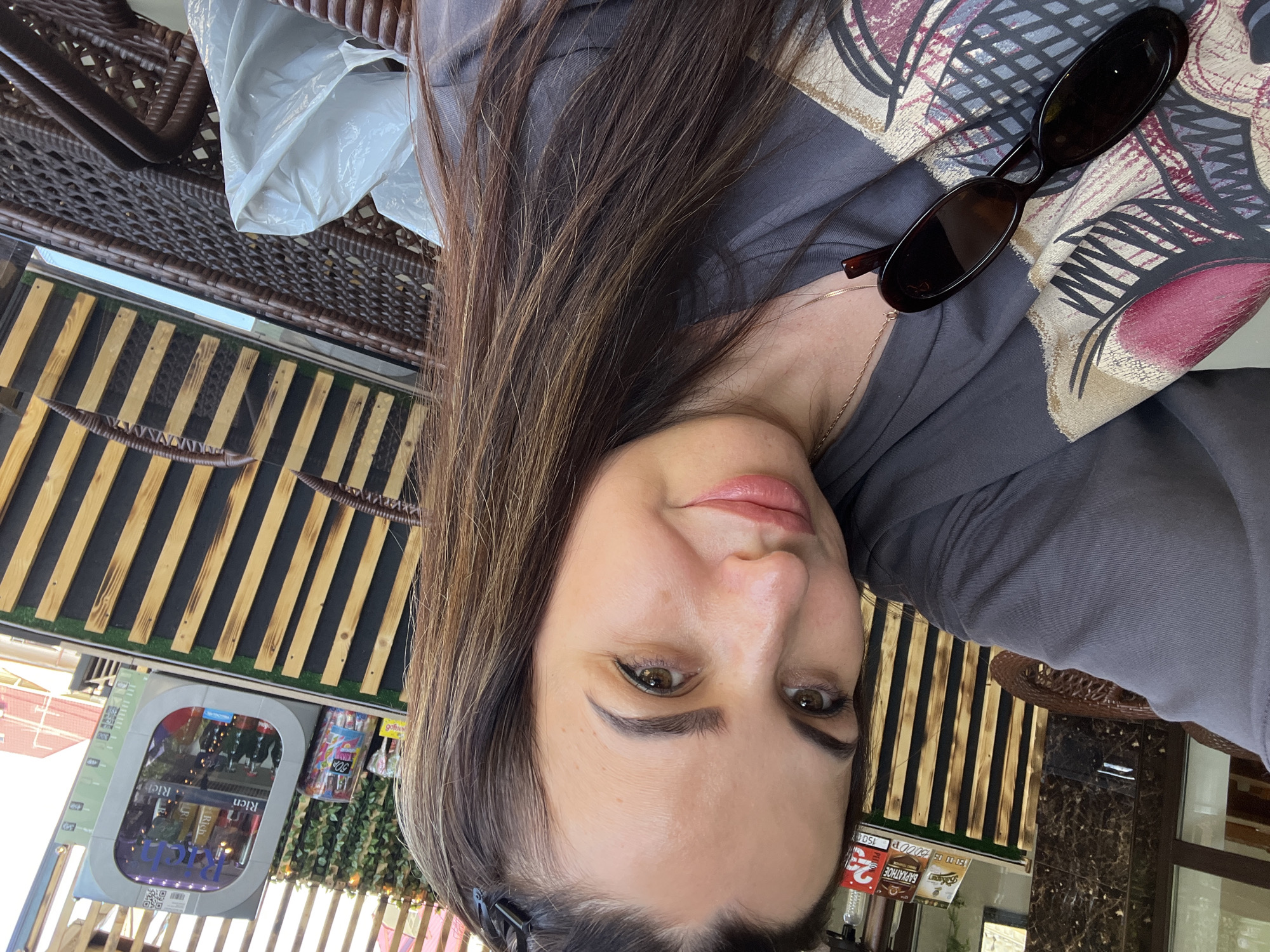 Woman documents casual afternoon outing with extended selfie session