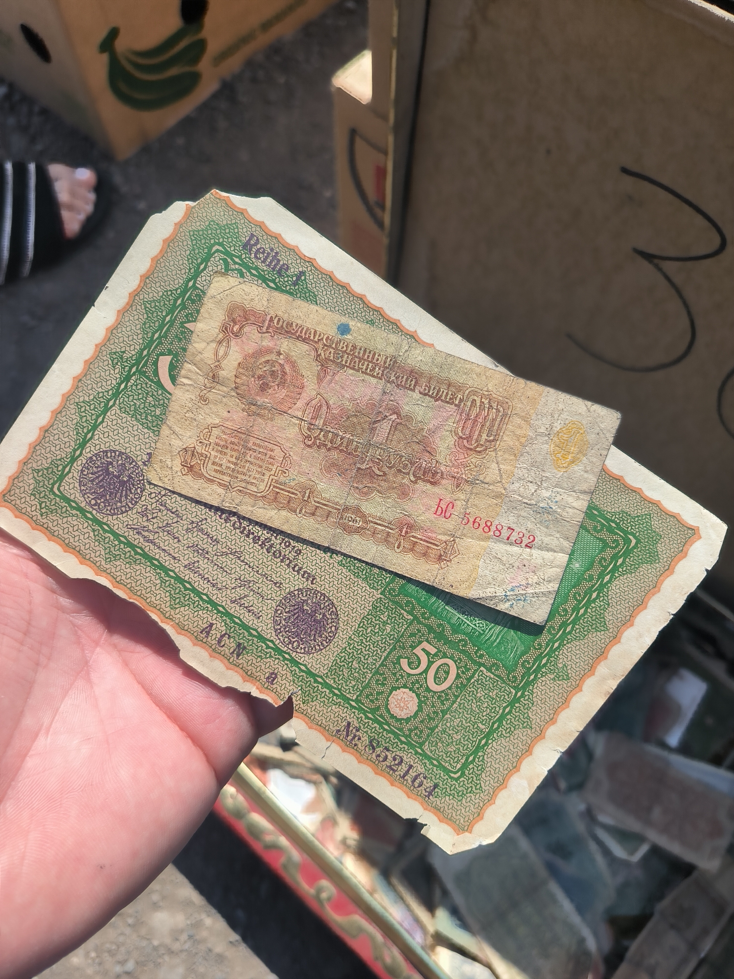 Prague flea market with antique weapons, currencies, and vintage gear