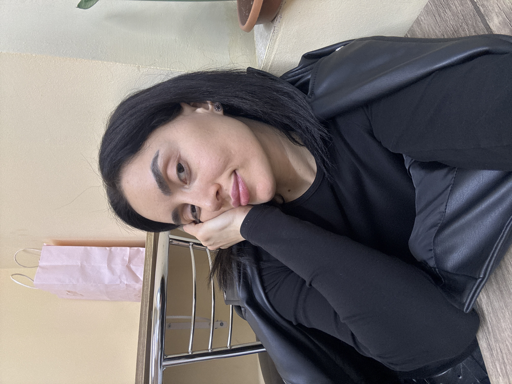 Woman photographed in multiple indoor settings around Tbilisi