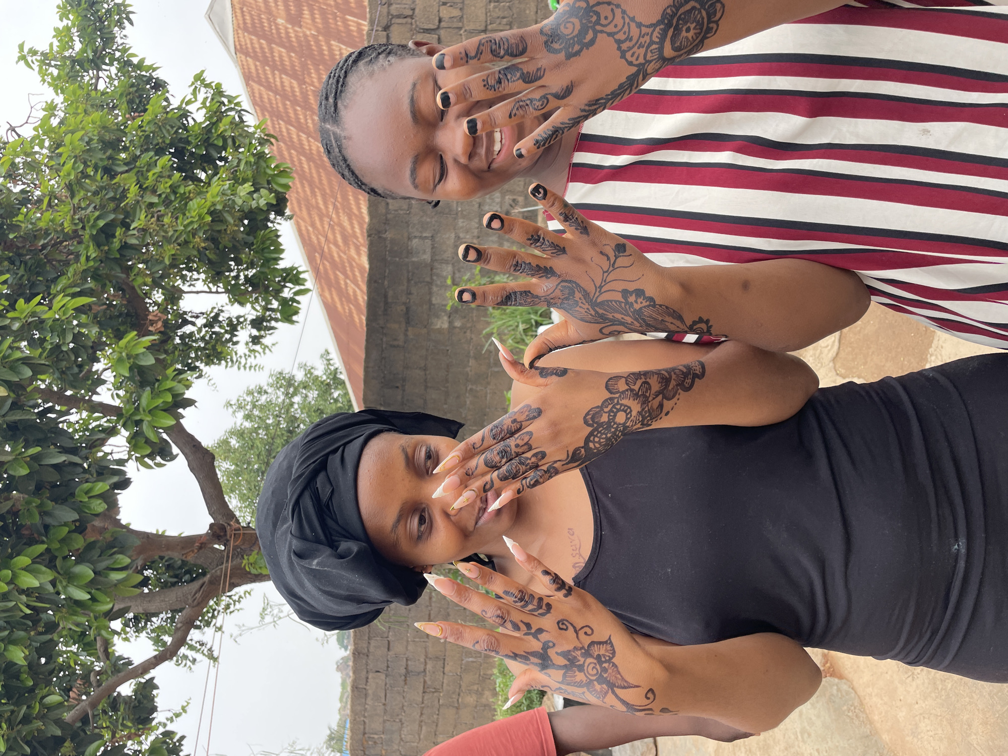 Women display henna hand art in Jos, Nigeria