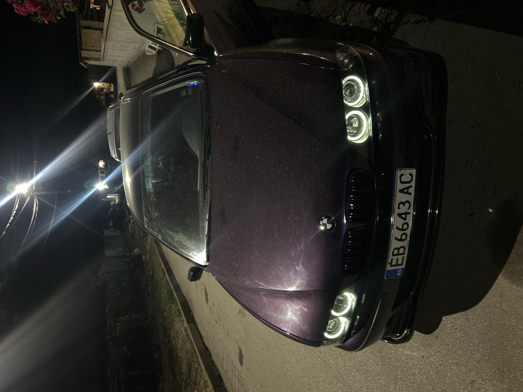Purple BMW spotted with door open on Kochevo street