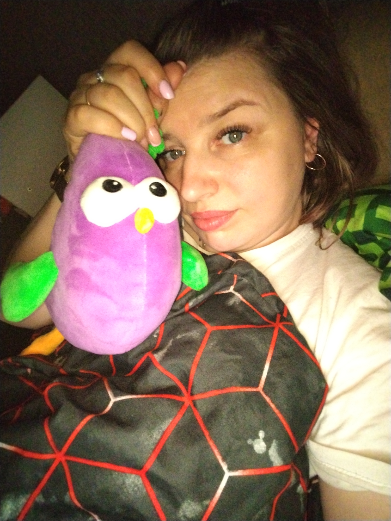 Woman with purple plush toy observed indoors in Шебунино