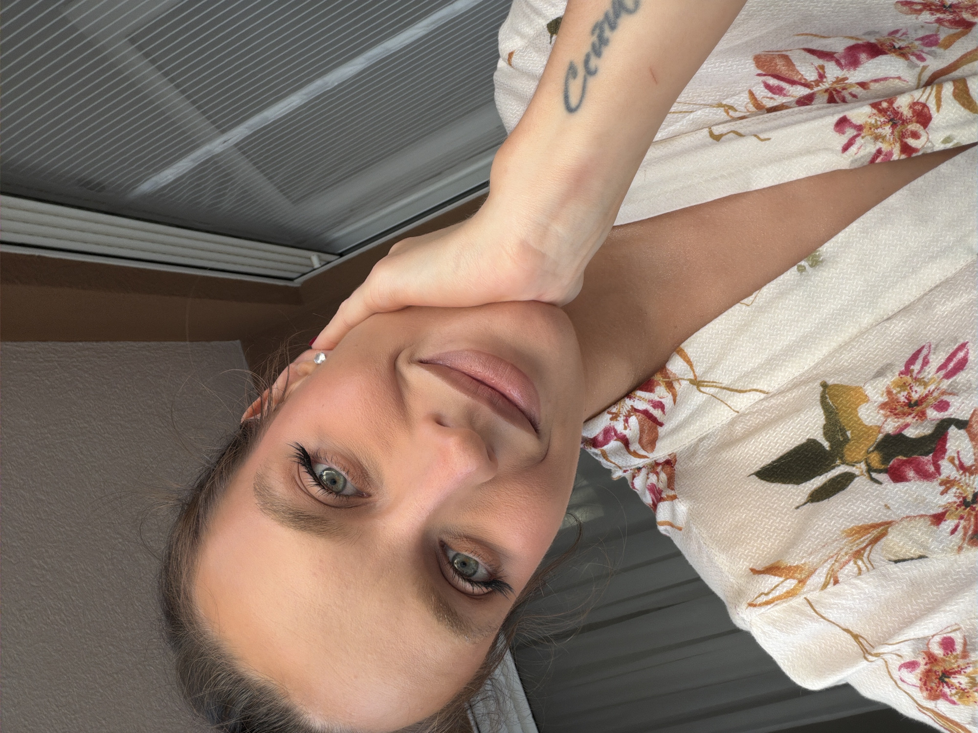 Woman takes selfies overlooking Budva rooftops
