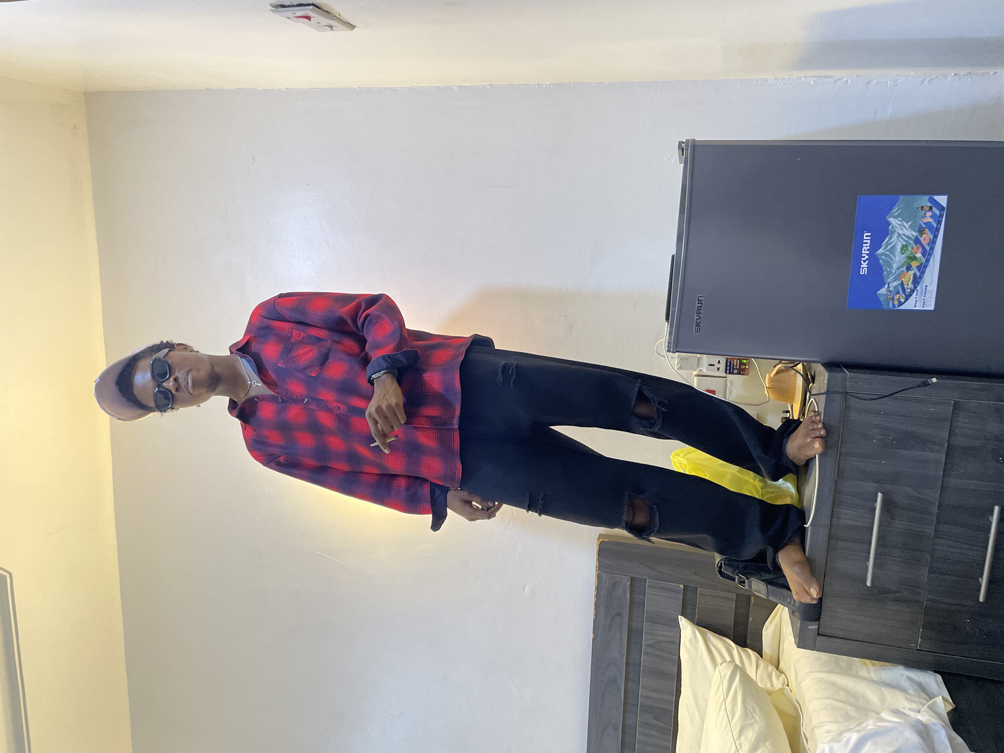 Young men hang out, take selfies in Awka room