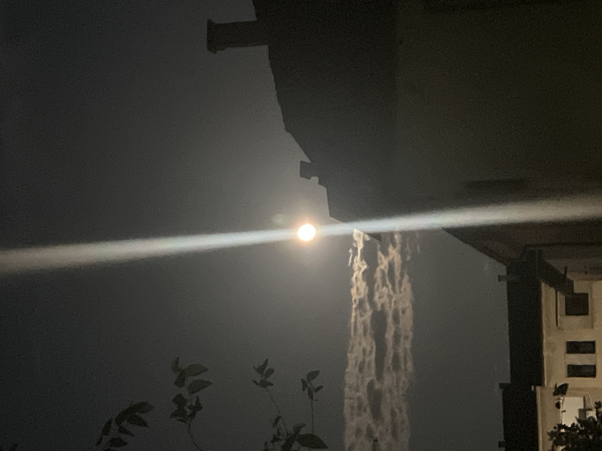 Full moon and light beam over Blagoevgrad on a July night