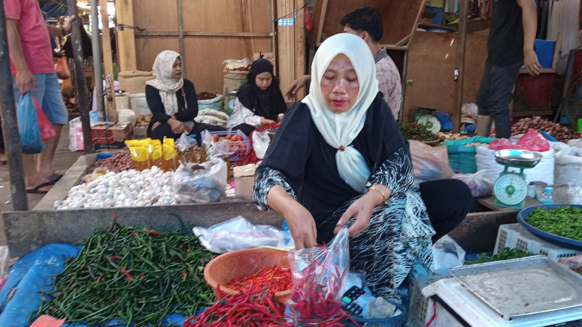 Lhokseumawe market district, busy morning across stalls and streets