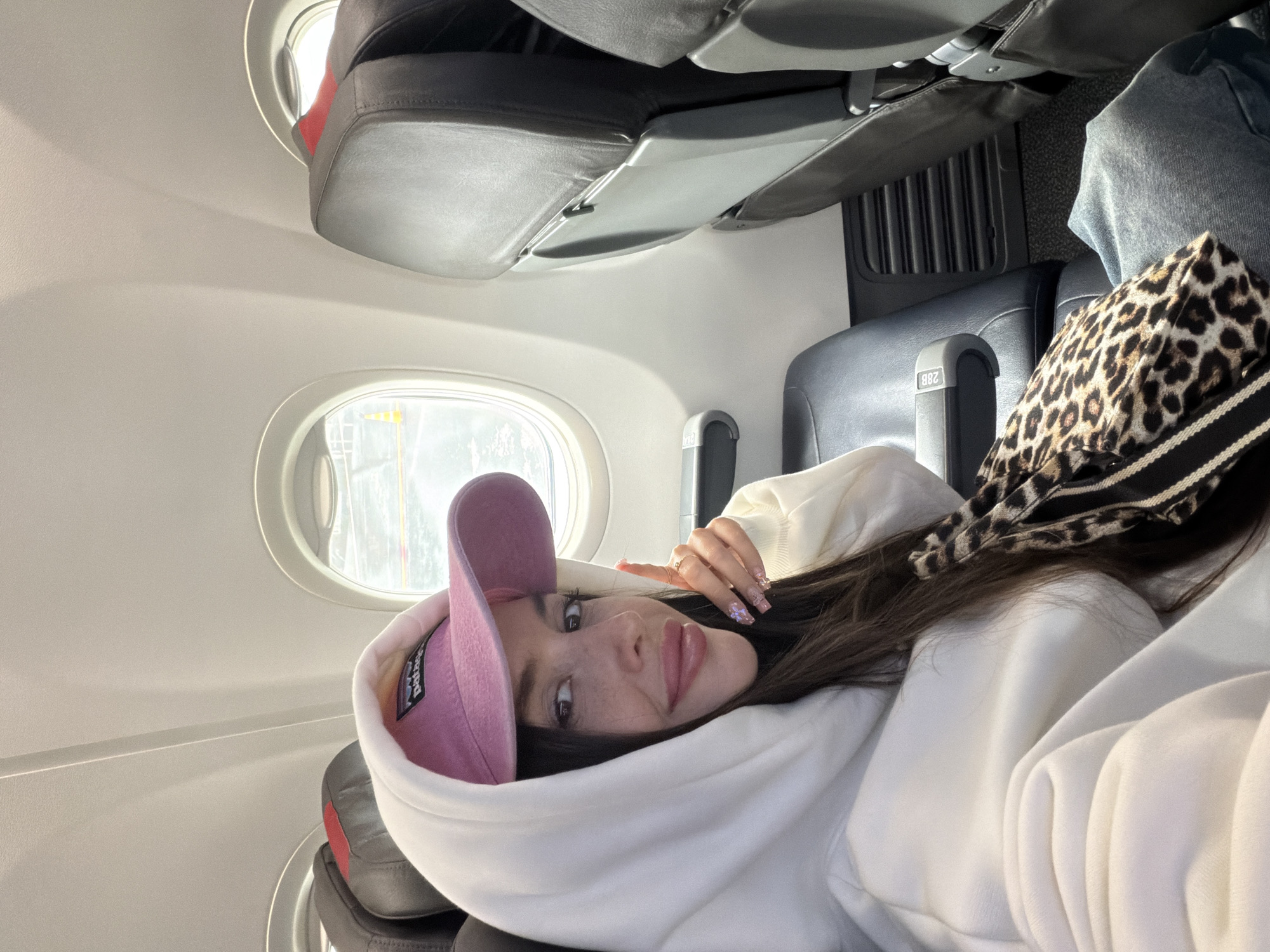 Passenger documents flight experience with cabin and tarmac photos