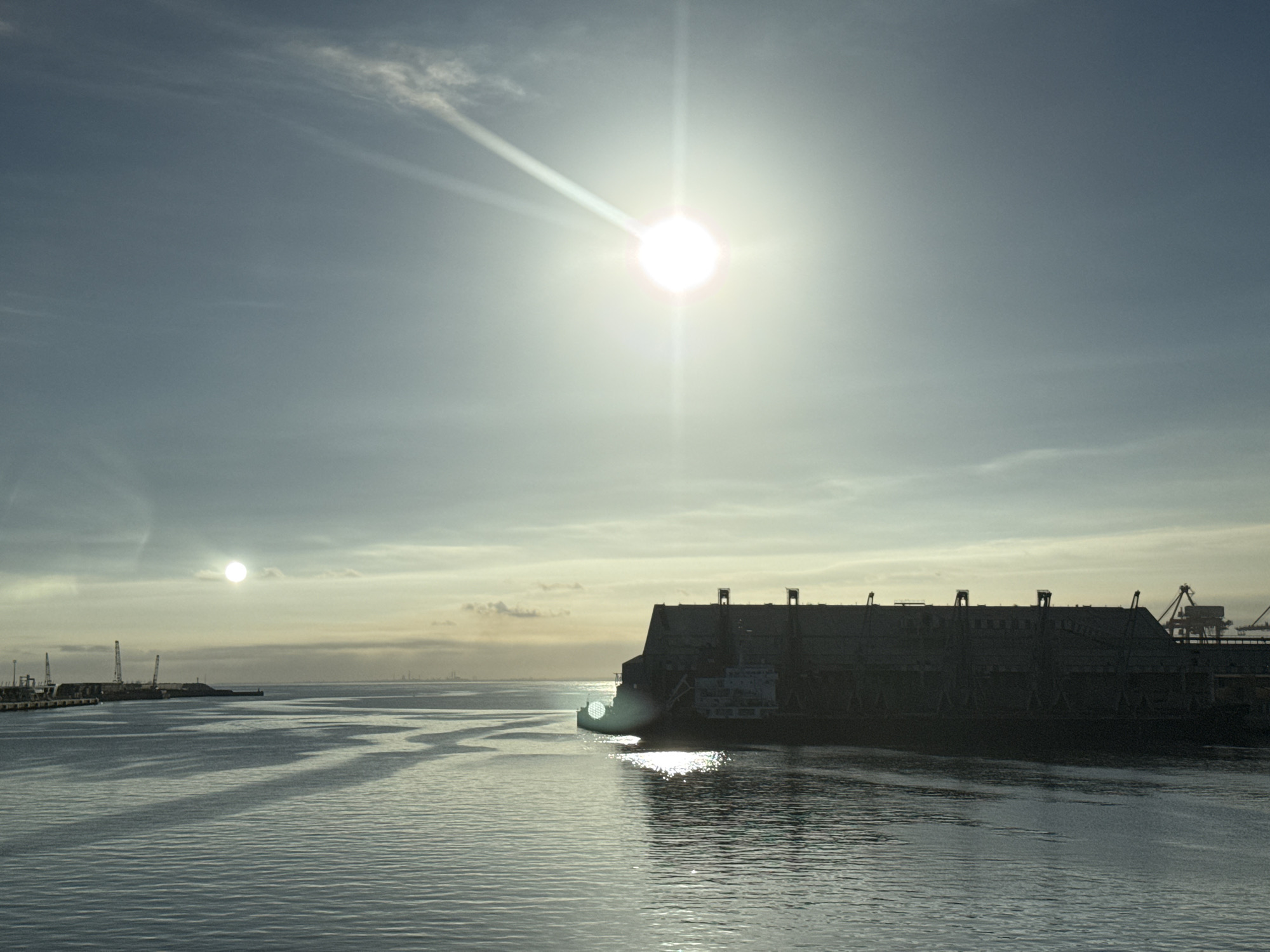 Floating dry dock anchored in Casablanca's sunlit harbor
