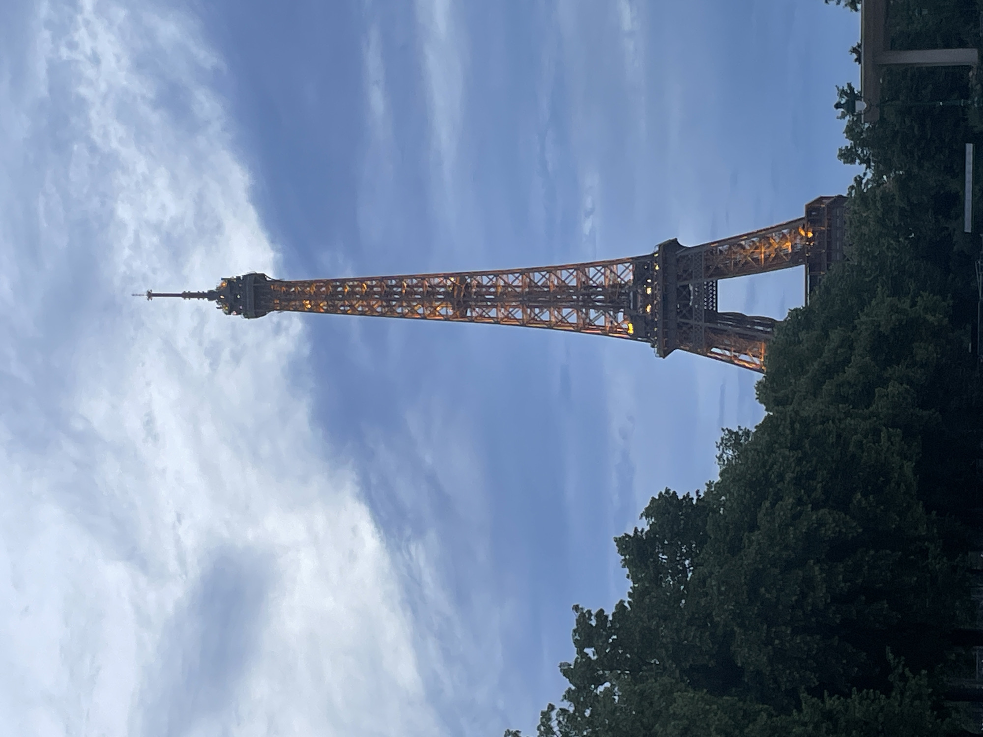 Eiffel Tower glows golden during evening illumination display