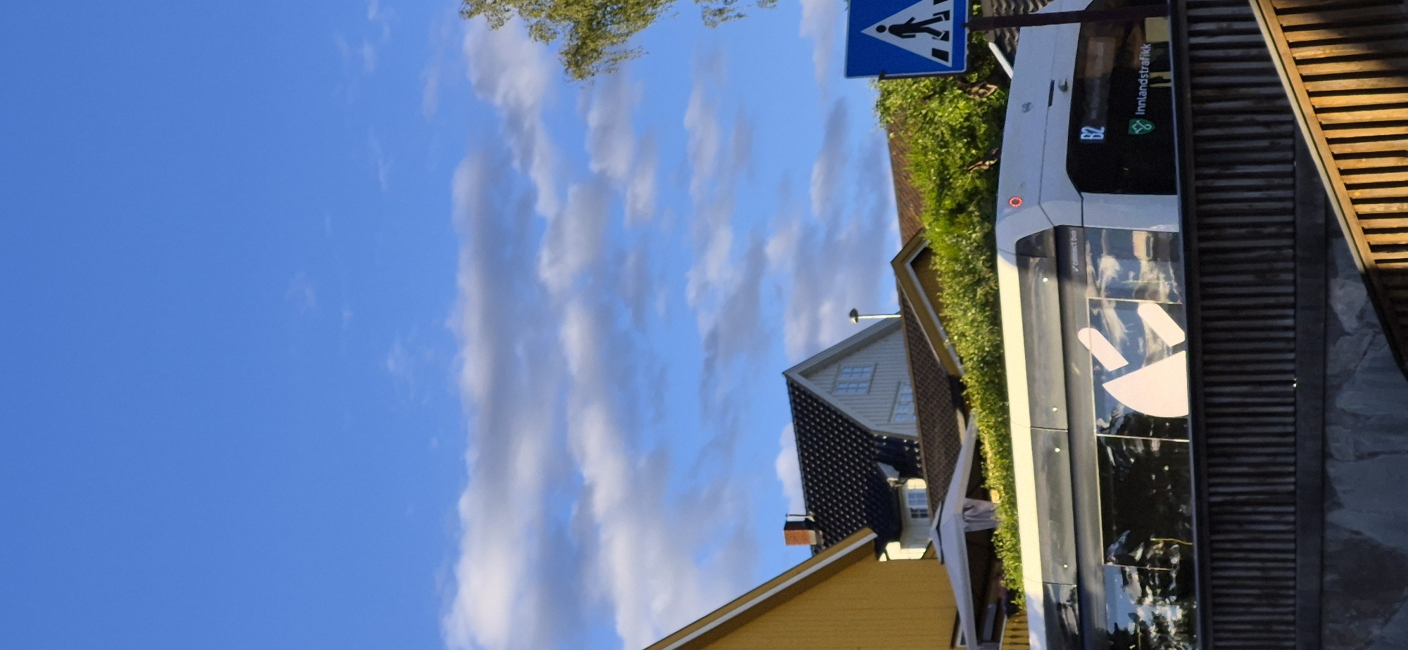 Sunny afternoon across quiet suburban streets and green surroundings