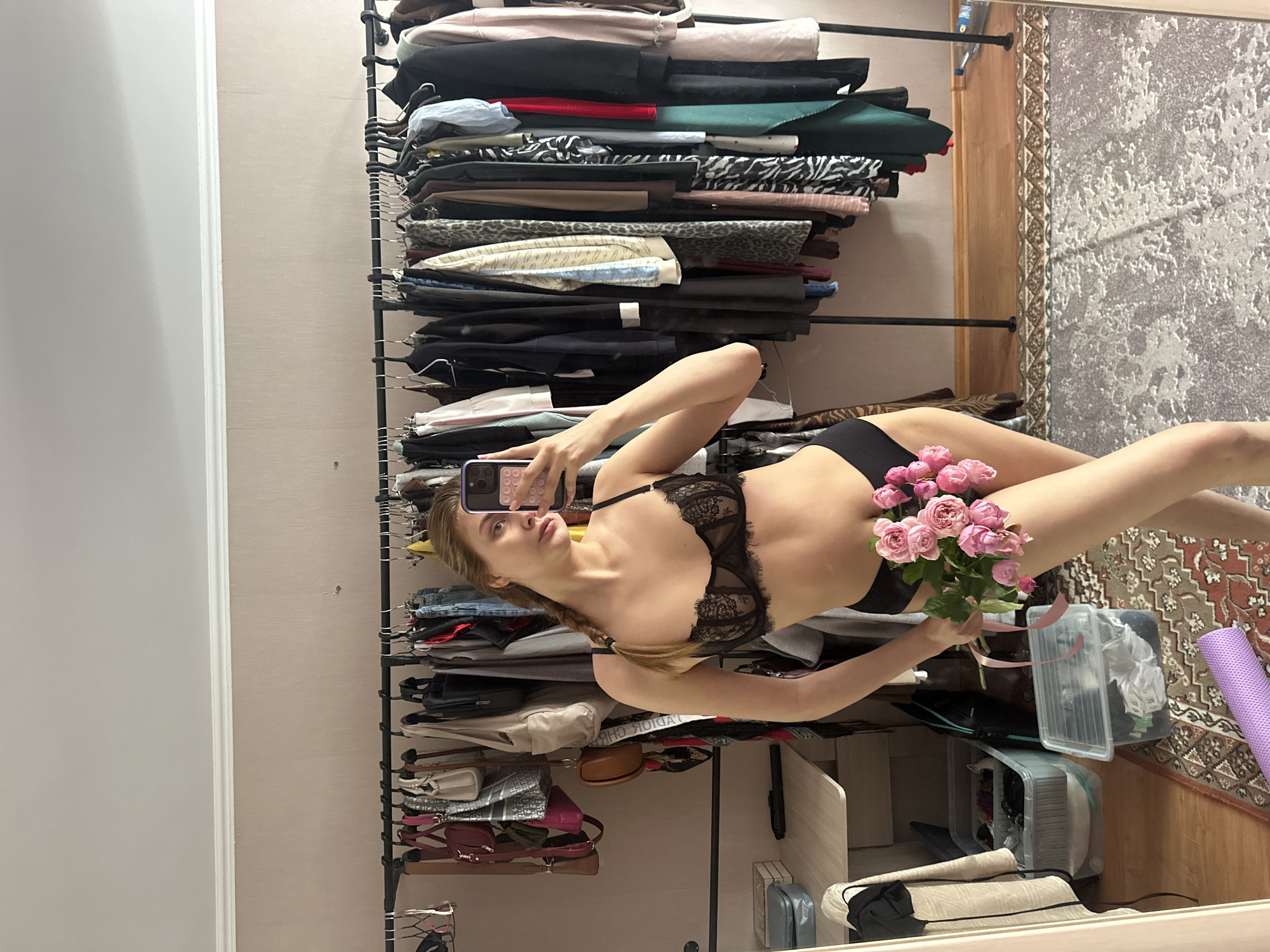 Woman takes selfies with roses in Krasnoyarsk residence