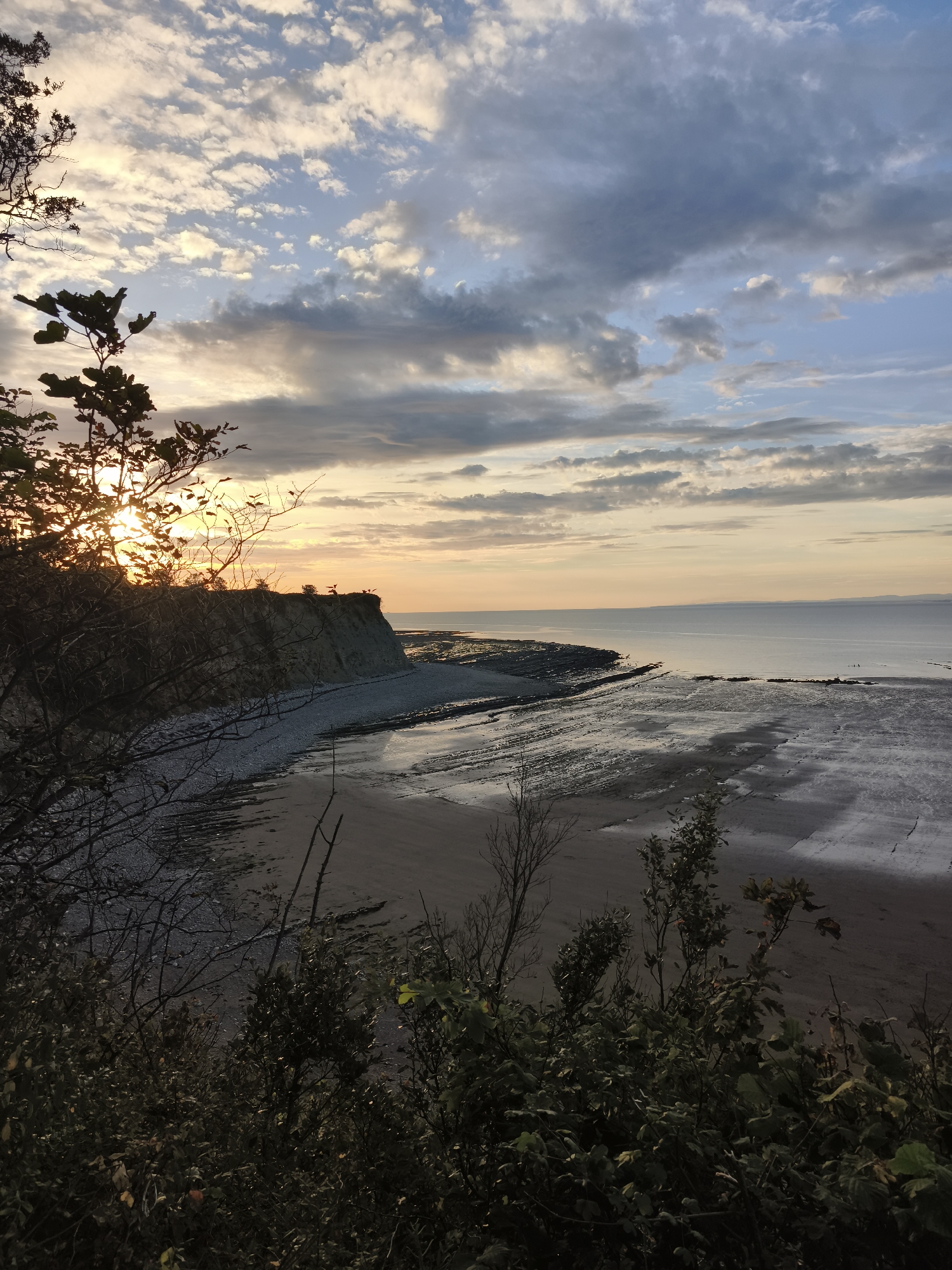 West Quantoxhead cliffs and beach at low tide, sunset