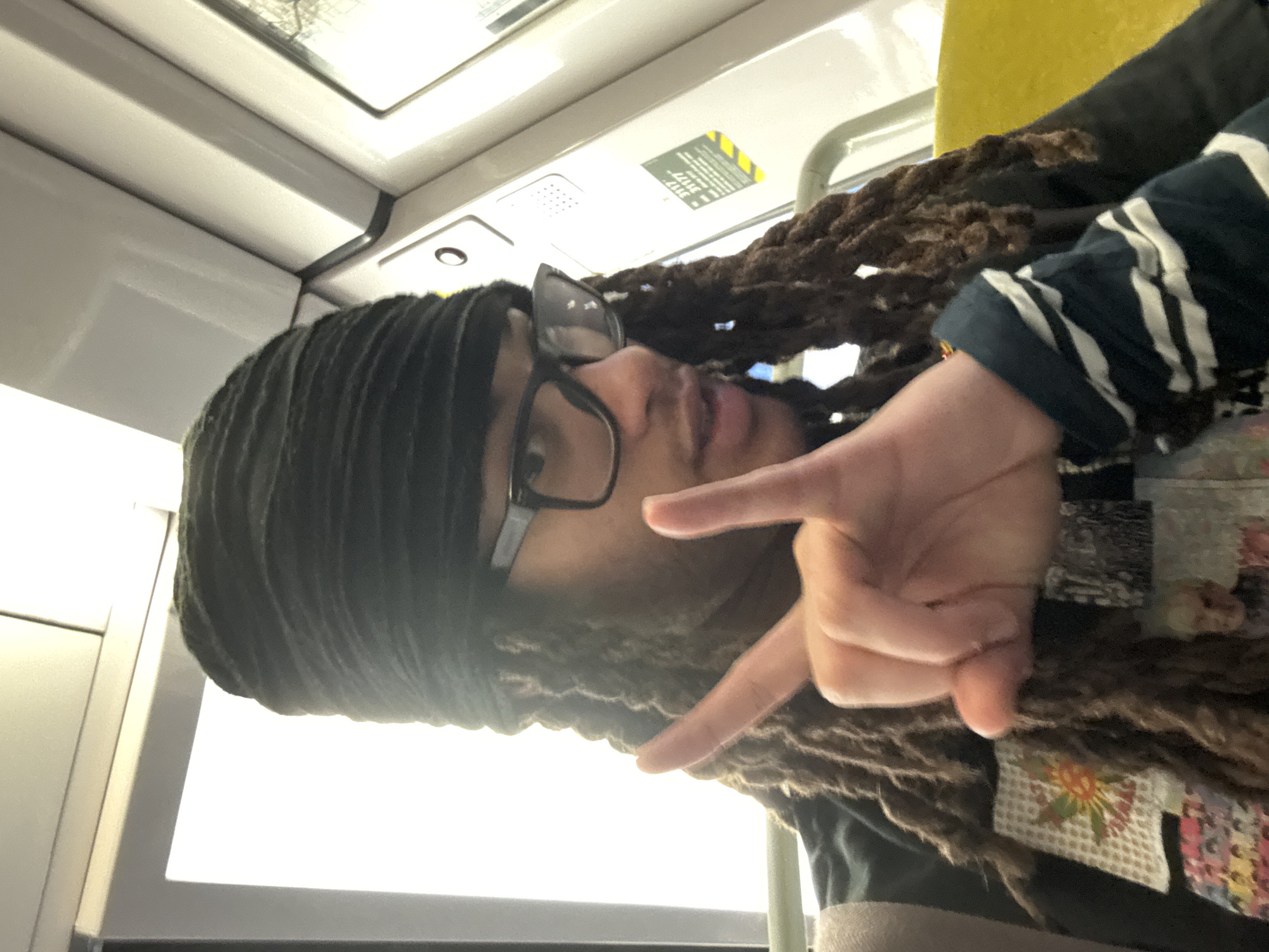 Person takes selfie on public transport in Massy