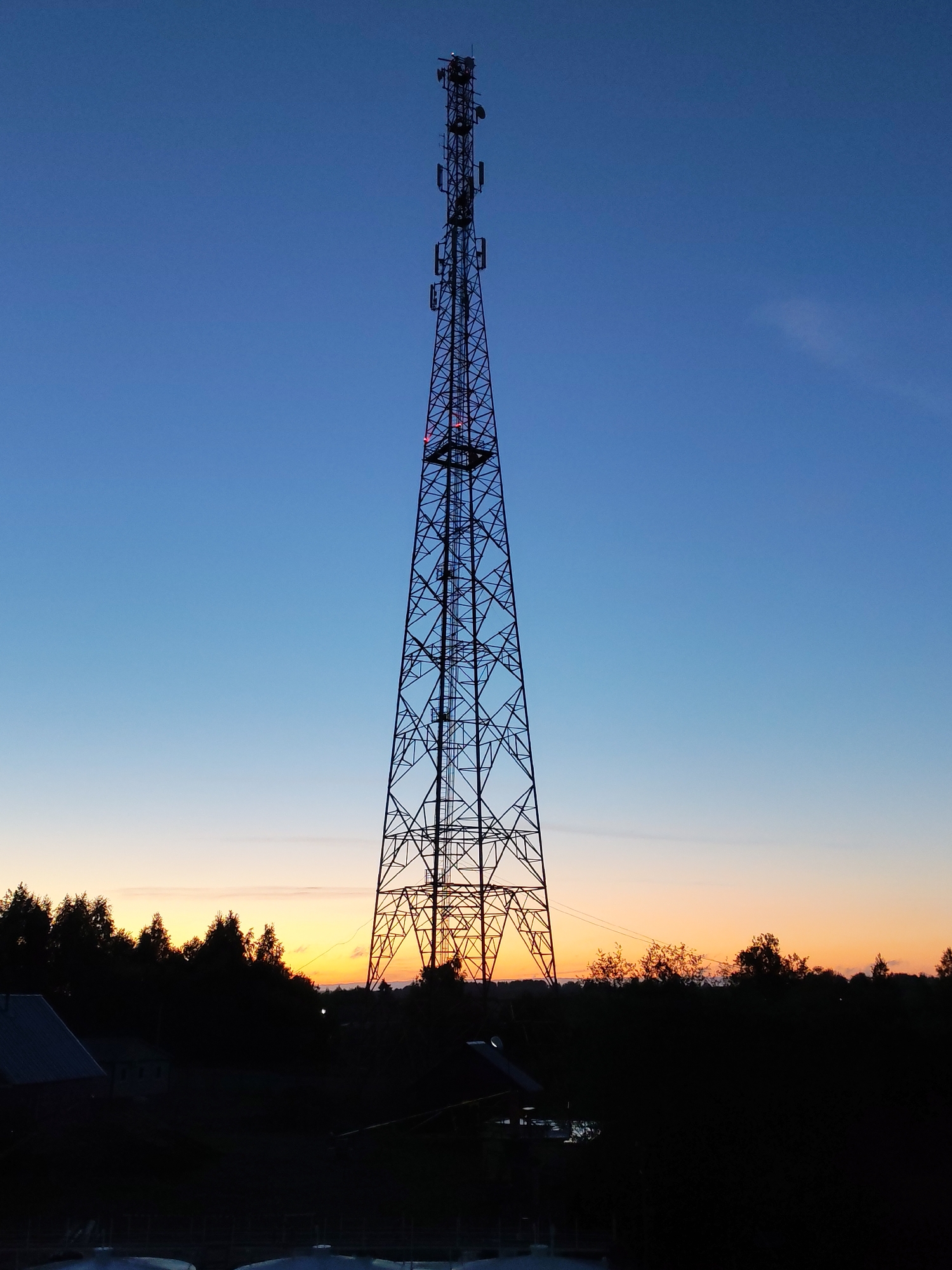 Twilight telecommunications towers documented at Russian ferry crossing