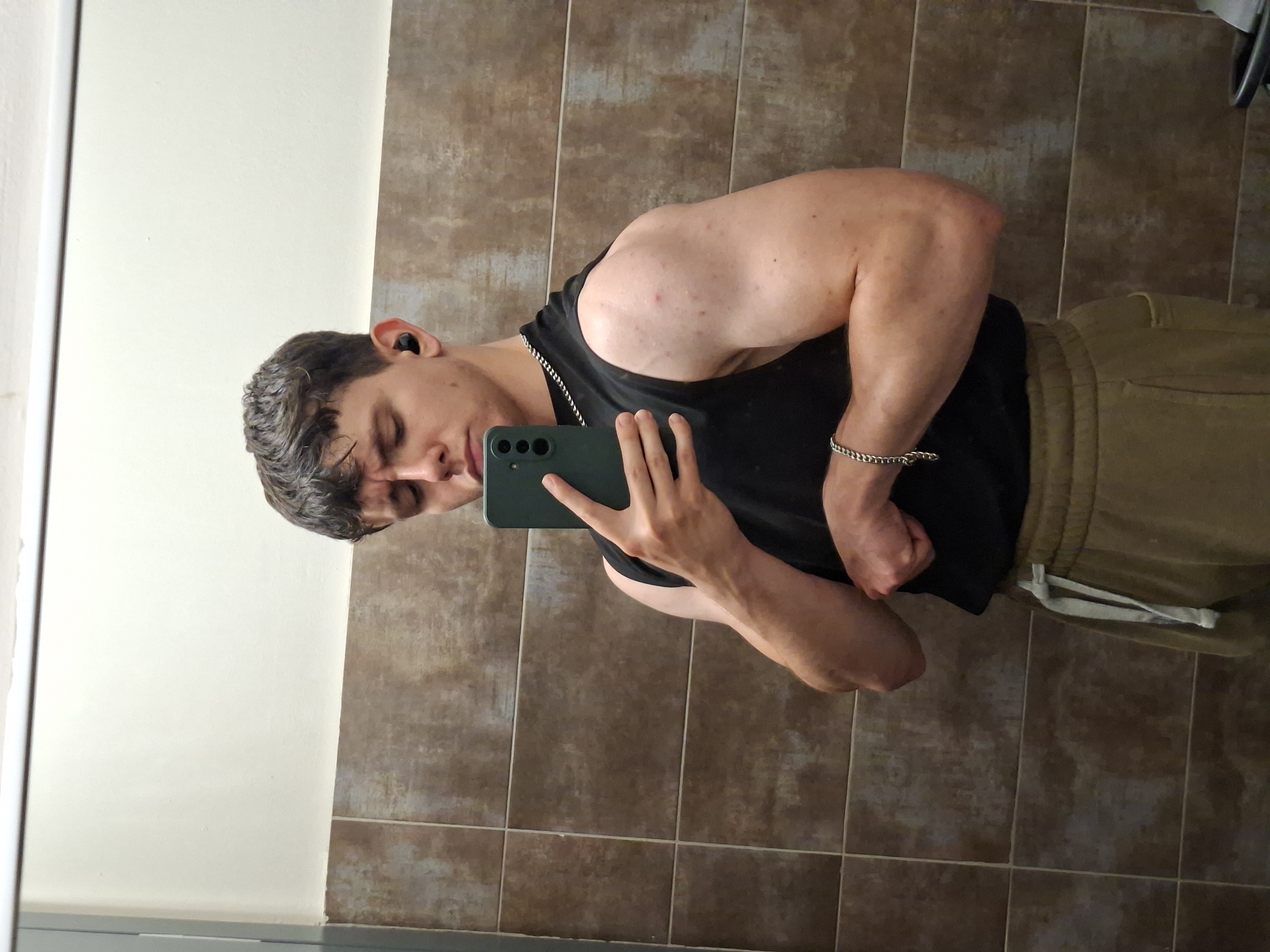 Young man takes mirror selfies indoors in Plovdiv