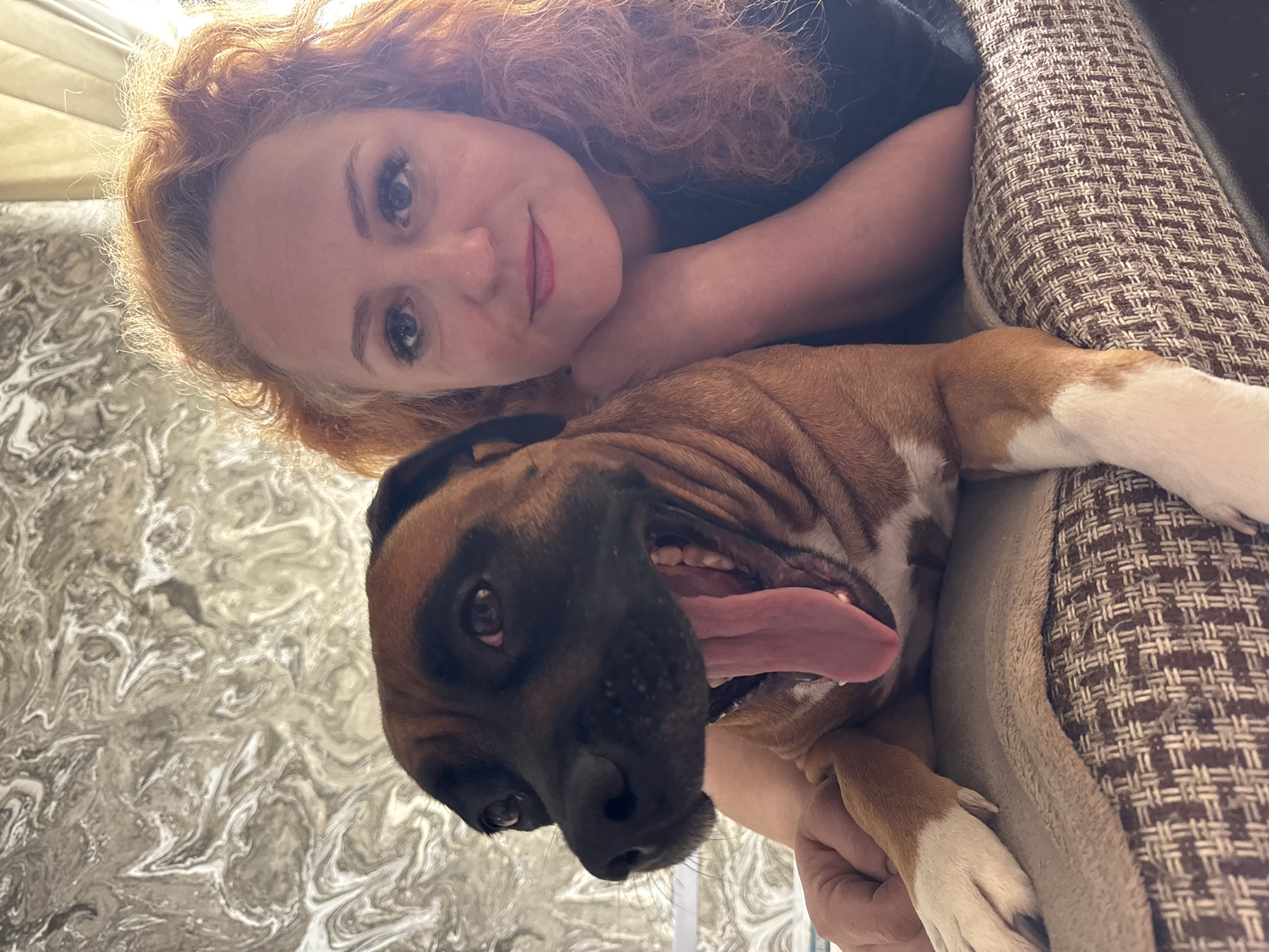 Woman and dog share quiet morning moments in Chaikovsky home