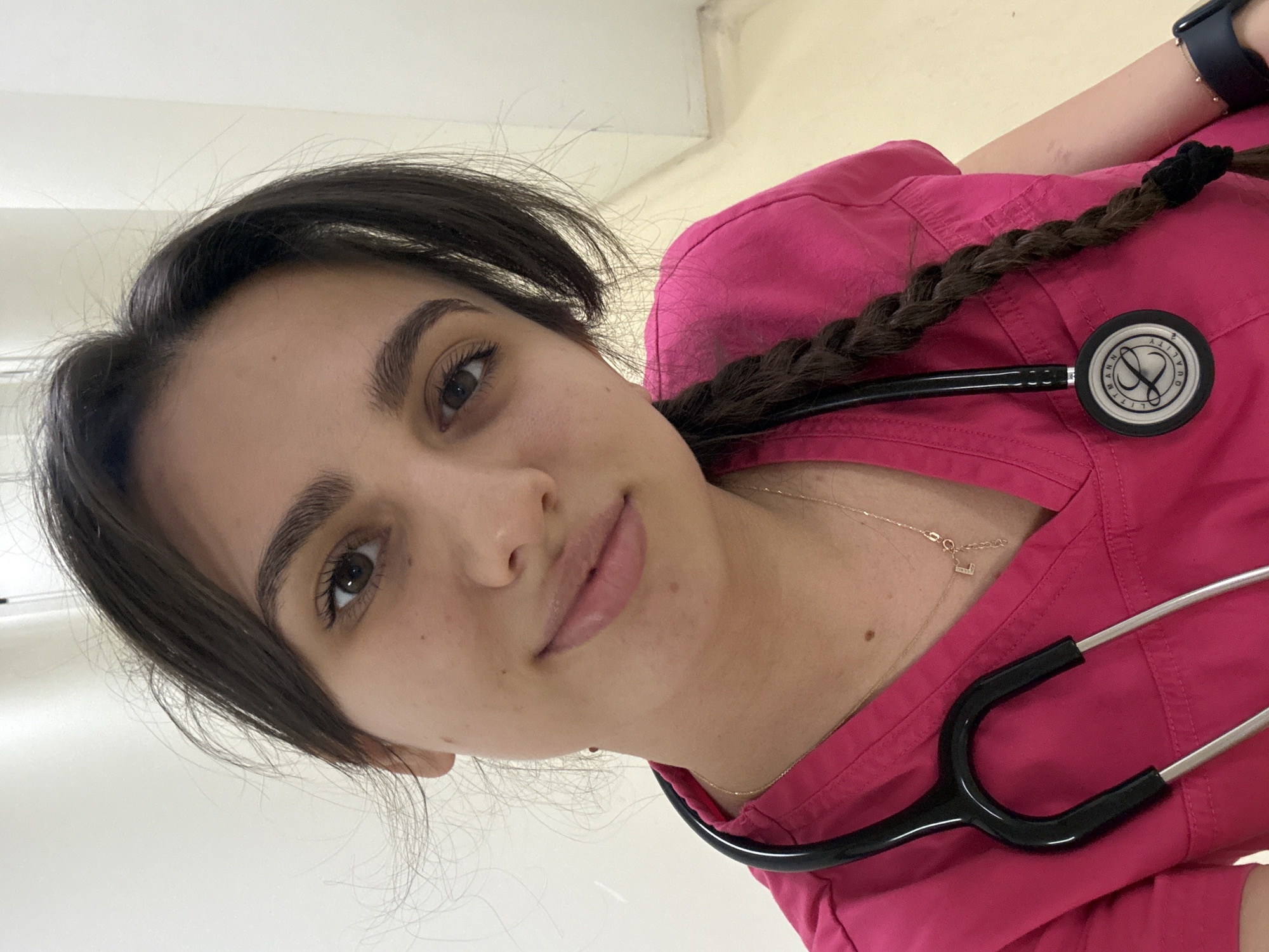 Healthcare worker in pink scrubs photographed in Sofia