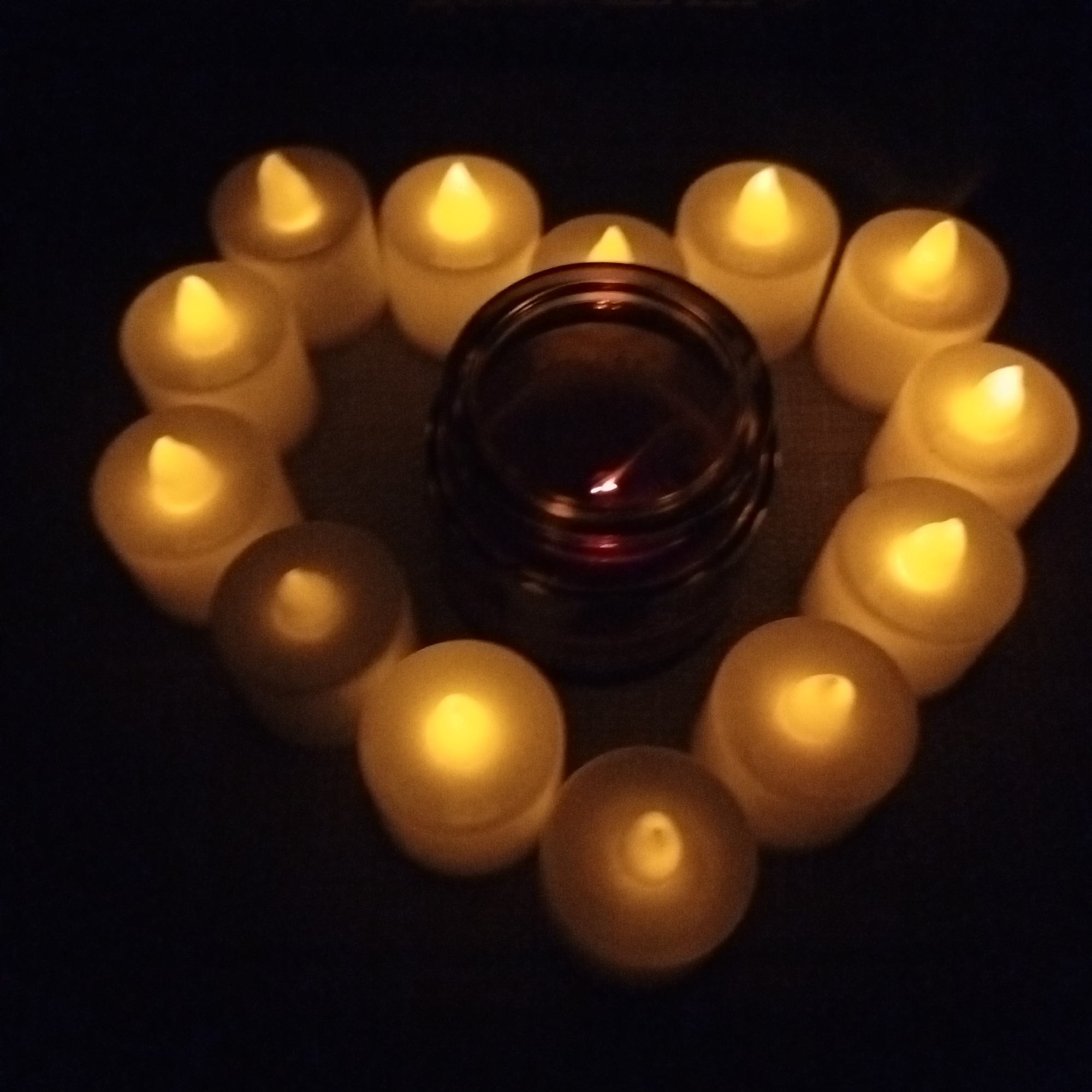 Candlelit heart arrangement and crepes in a cozy indoor setting