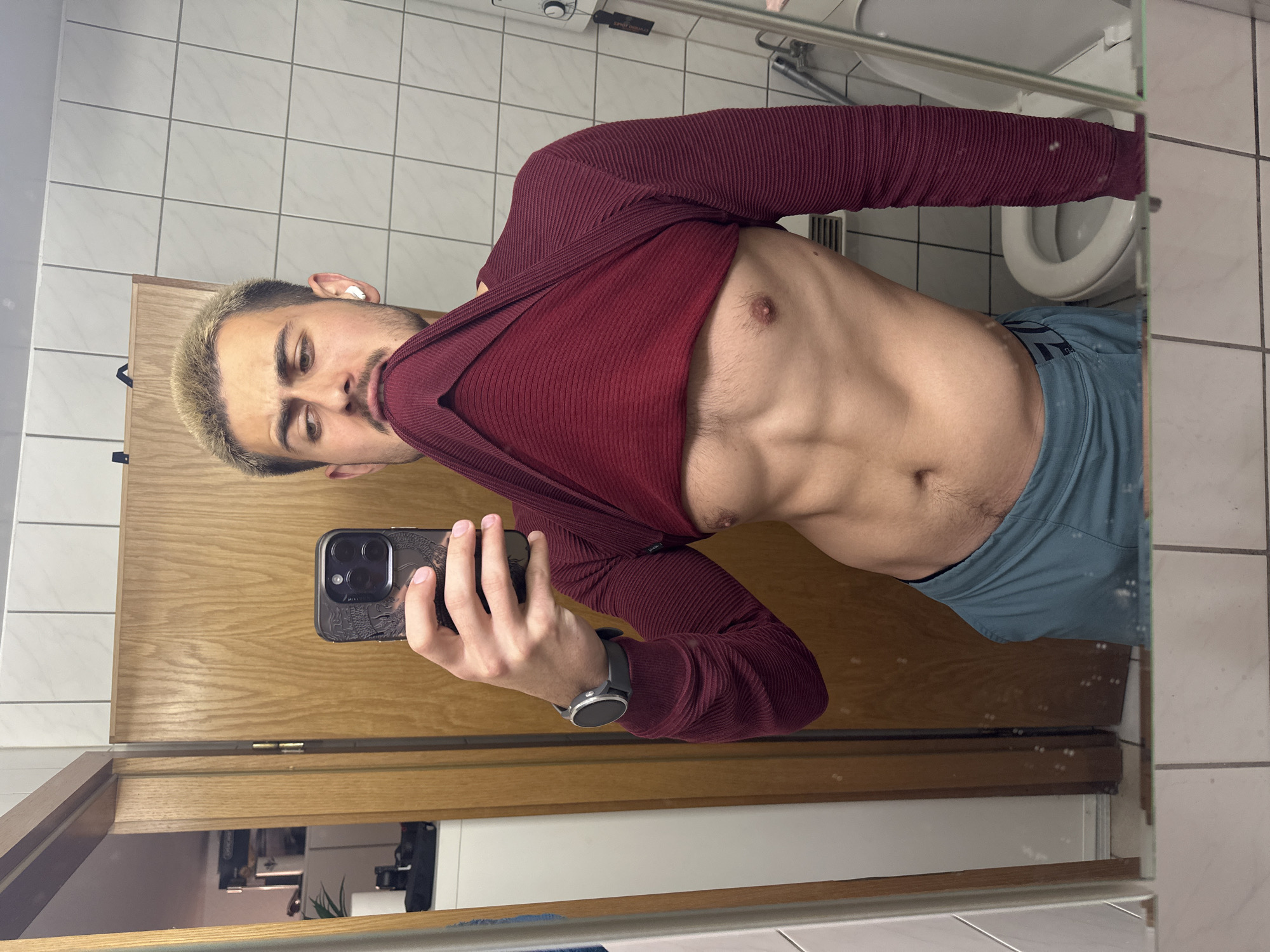 Man takes bathroom mirror selfies in Essen, Germany