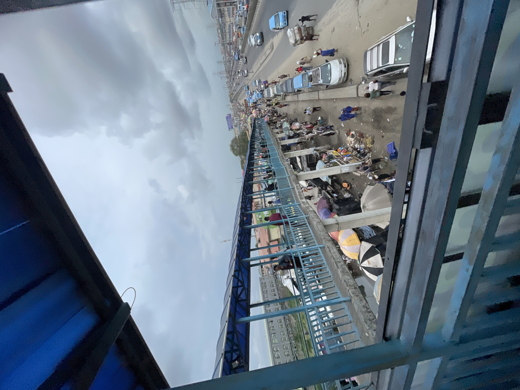Pedestrian bridge witness captures busy Lekki street market activity