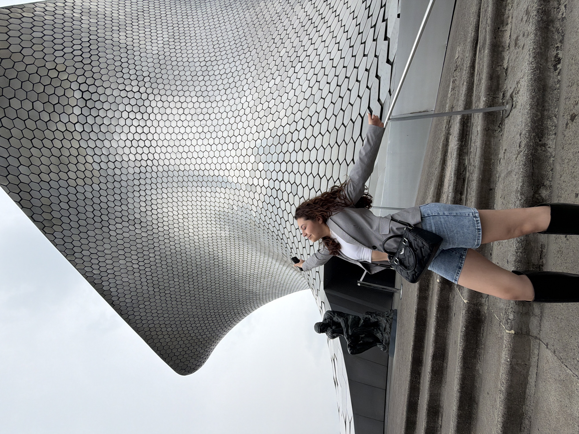 Woman poses for photos at Mexico City's Museo Soumaya