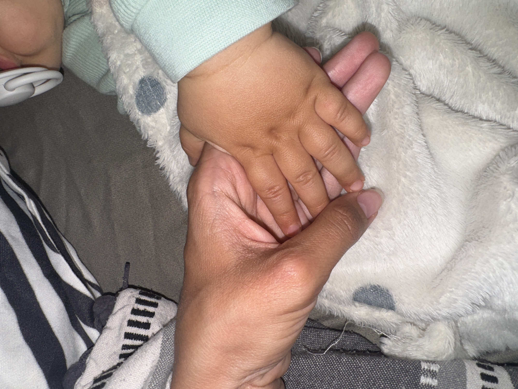 Tender moment captured between adult and baby in Berkovitsa
