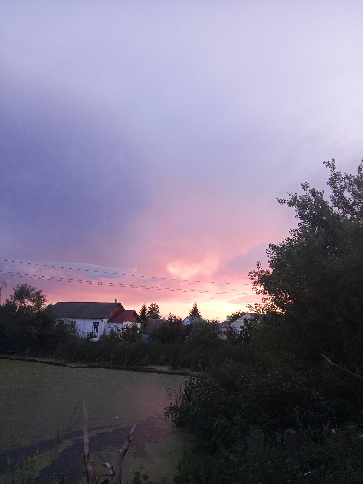 Summer dusk sky over rural Panino, Russia