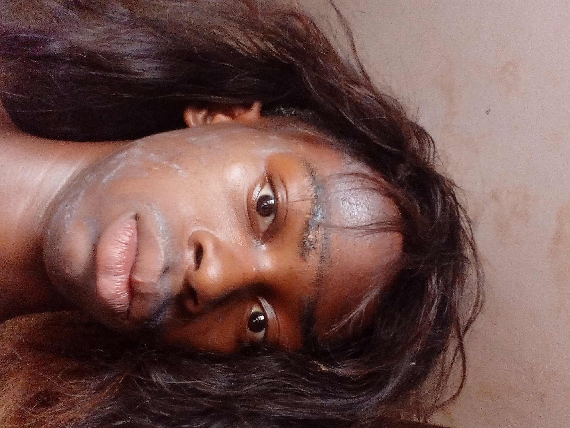 Young man documents traditional body painting session in Onitsha