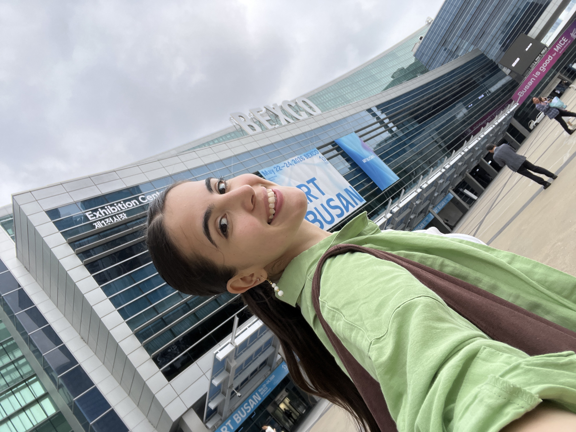 Woman takes selfie at ART BUSAN exhibition opening