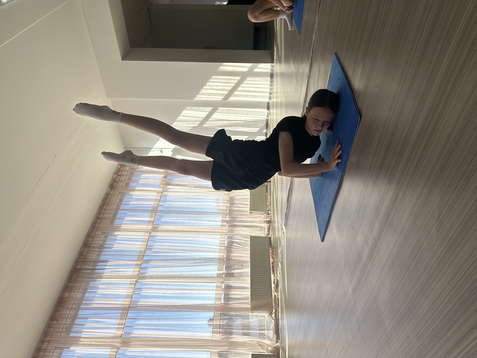 Dance studio stretching session observed in Votkinsk, Russia