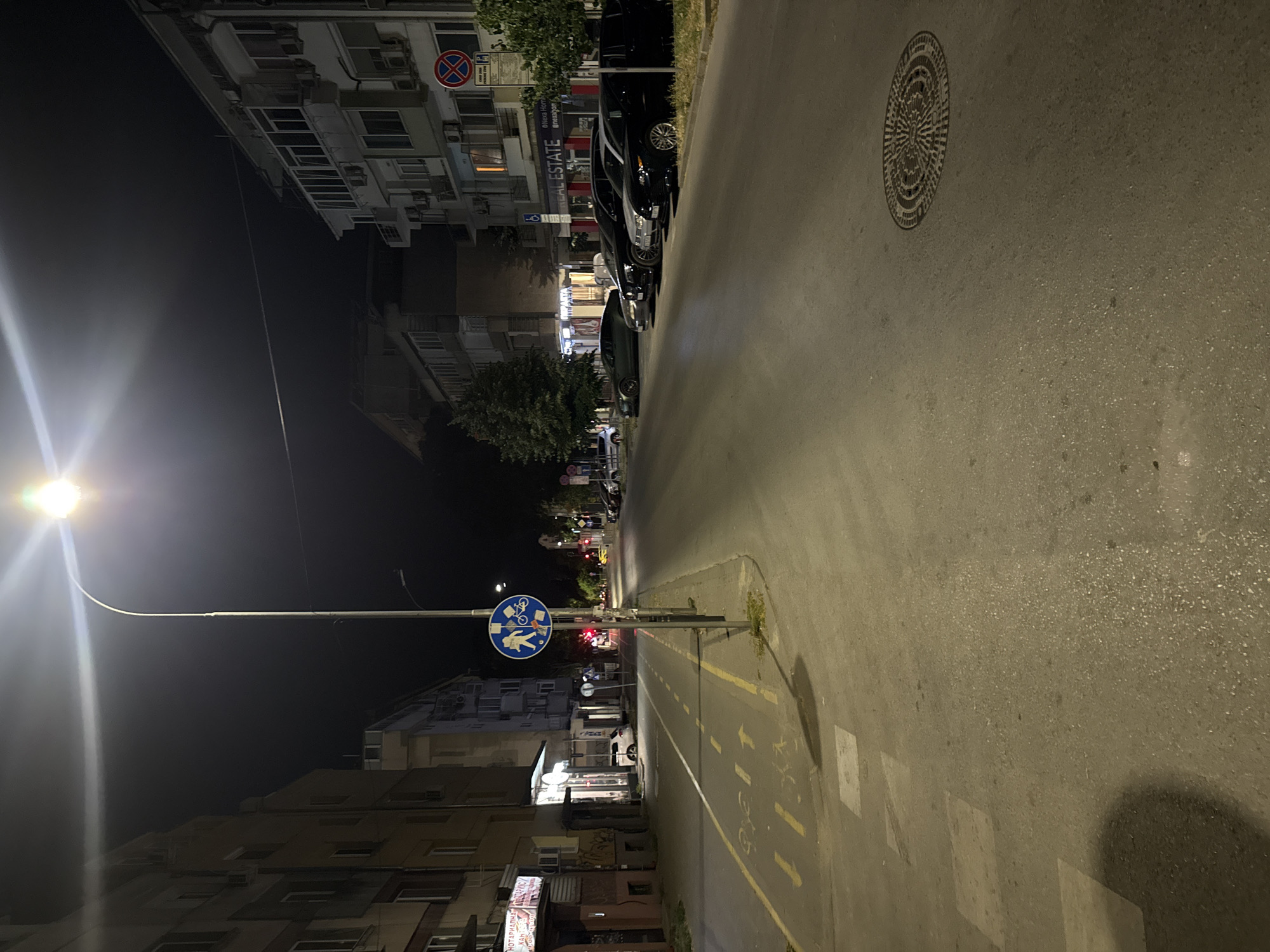 Varna street at night, bike lanes and parked cars