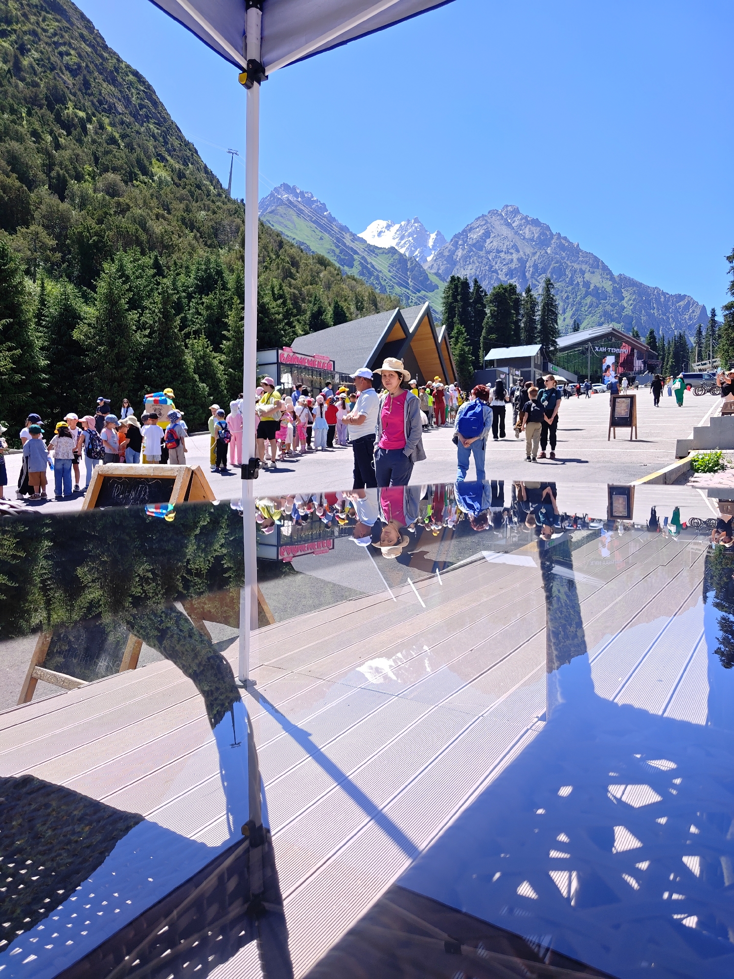 Kids hiking in line through a sunny mountain destination