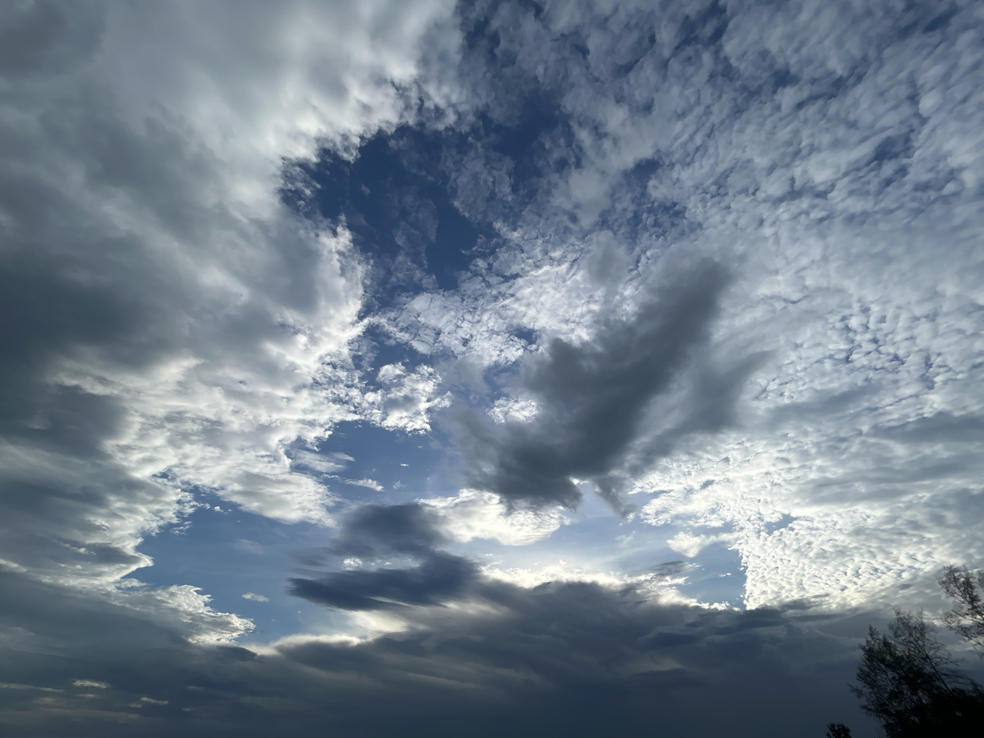 Dramatic skies and weathered boats captured on Koh Phangan shores