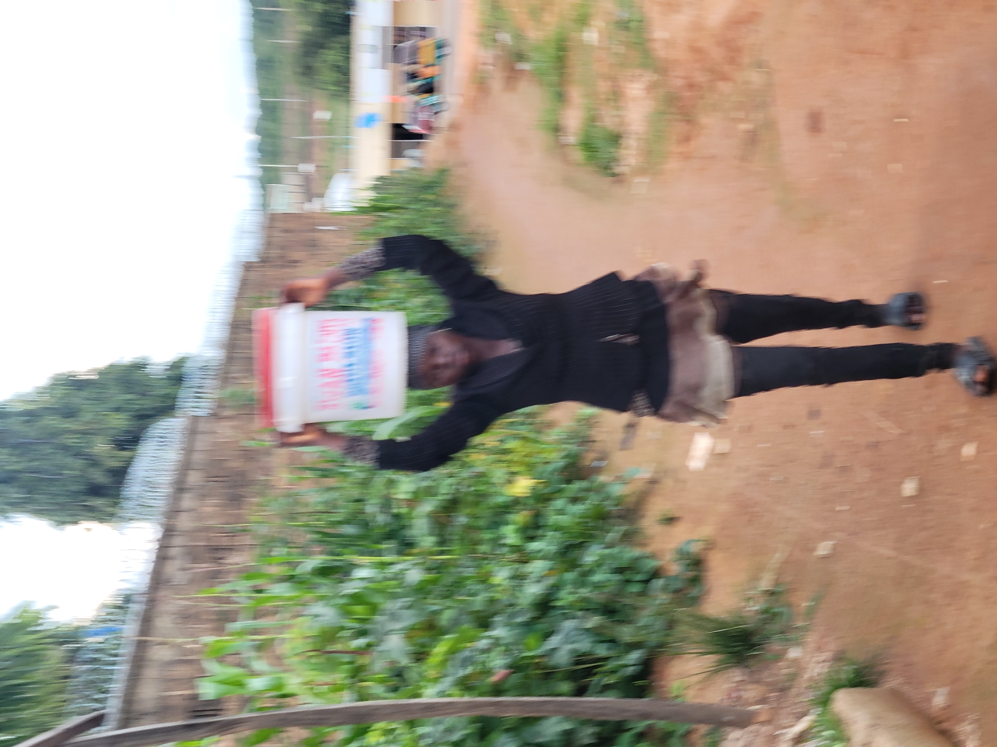 Everyday street life in Jos, Nigeria on a cloudy afternoon