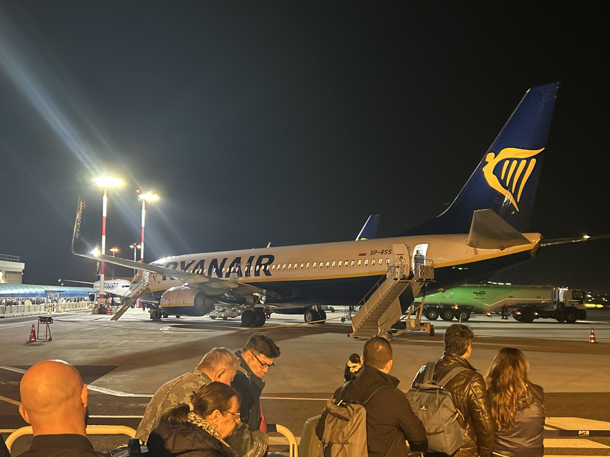 Nighttime passenger boarding at Rome Ciampino Airport