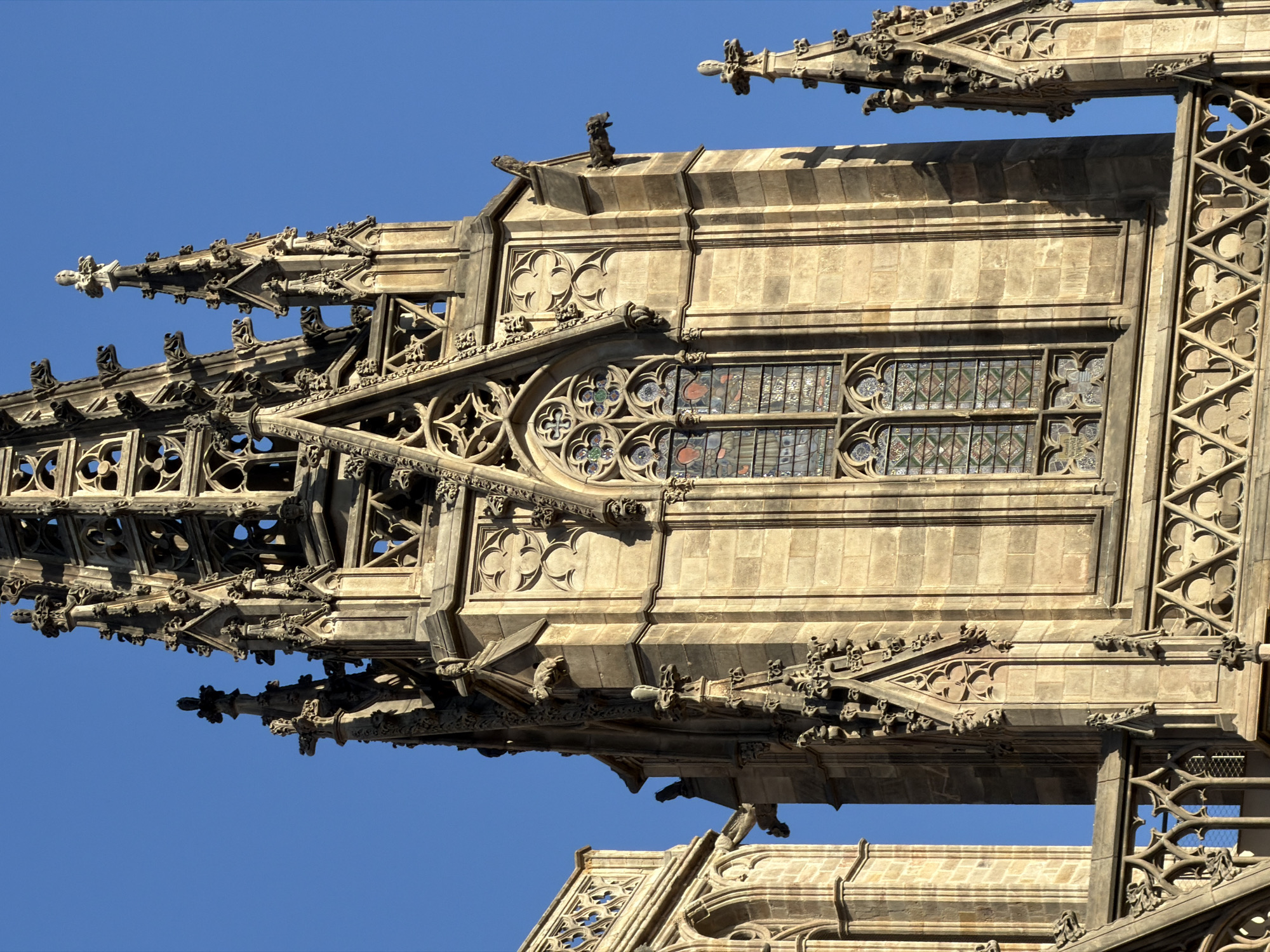 Up close with Barcelona Cathedral's Gothic facade on a sunny afternoon