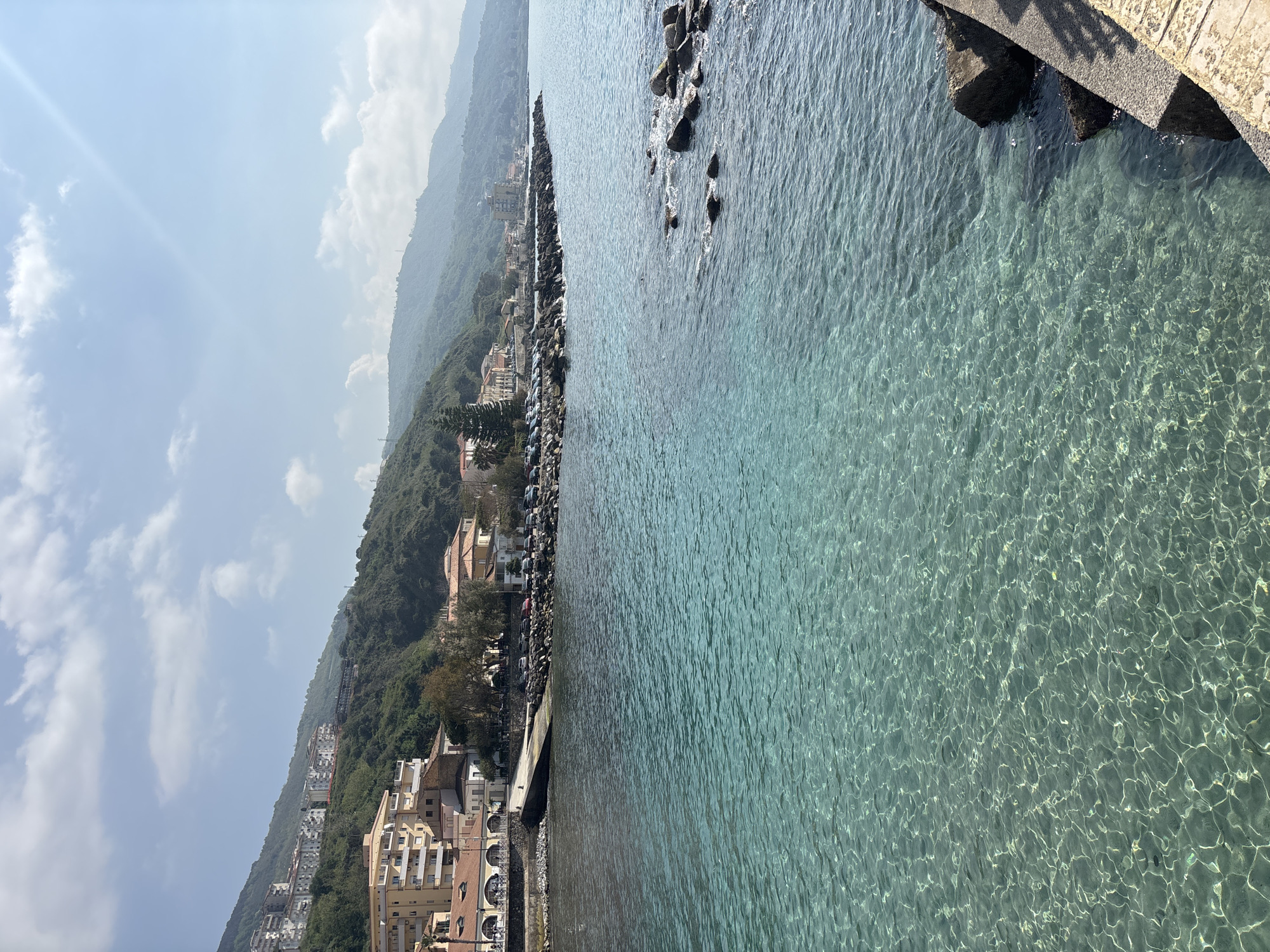 Beachgoers enjoy clear waters at Pizzo, Italy coastline