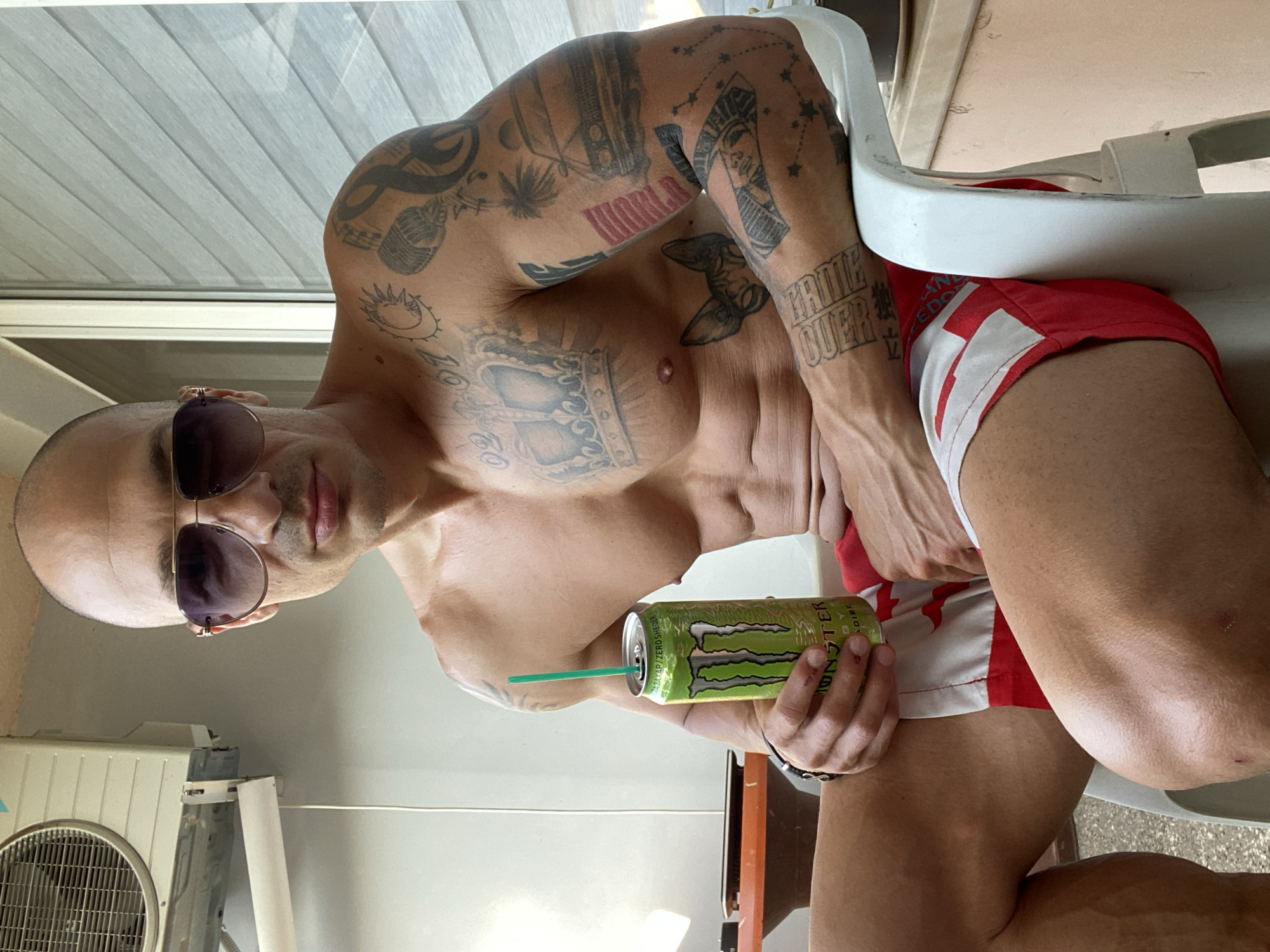 Man drinks energy drink outdoors in Pleven, Bulgaria
