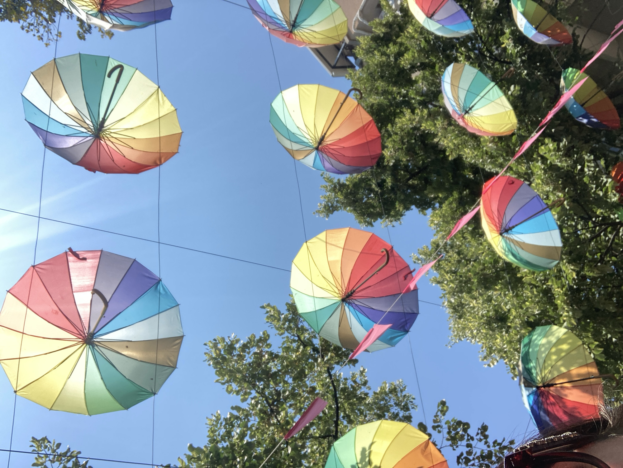 Burgas pedestrian street dressed up with umbrellas and flags