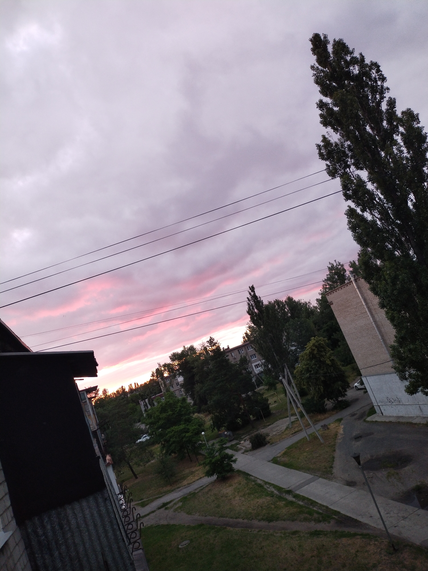 Evening scenes from Horishni Plavni: dusk, soup, and dog